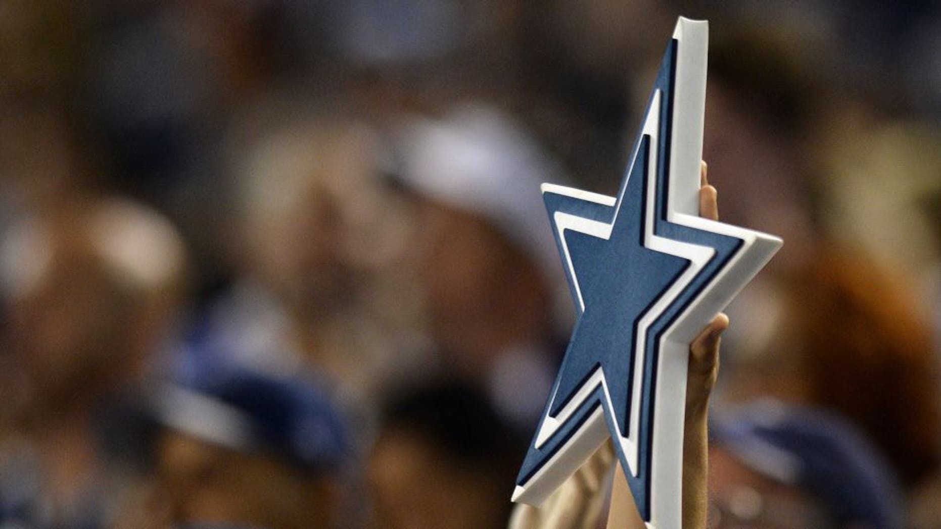 Aug 13, 2015; San Diego, CA, USA; A Dallas Cowboys fan hold up their logo during the third quarter against the San Diego Chargers in a preseason NFL football game at Qualcomm Stadium. Mandatory Credit: Jake Roth-USA TODAY Sports