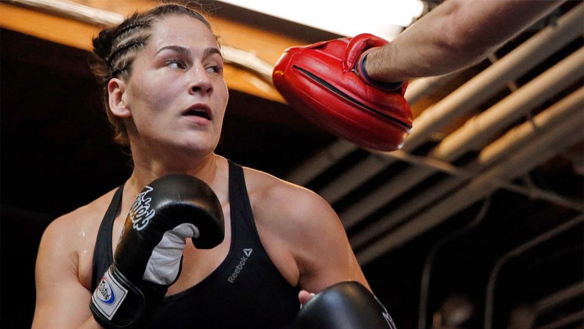 CHICAGO, IL - JULY 23: UFC women's No. 5 bantamweight contender Jessica Eye with boxing coach Alex Cooper during UFC Fight Night: Open Workouts at UFC Gym River North on July 23, 2015 in Chicago, Illinois. (Photo by Jon Durr/Zuffa LLC/Zuffa LLC via Getty Images)