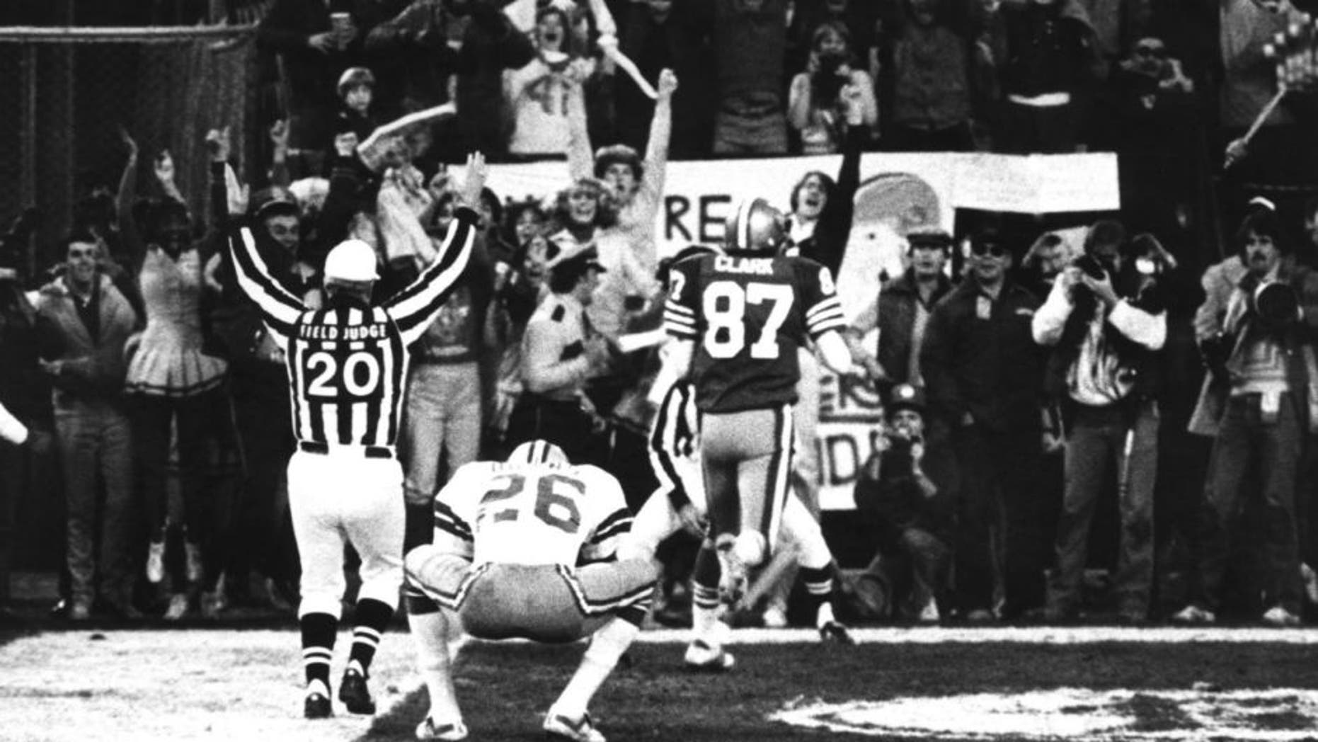 Wide receiver Dwight Clark of the San Francisco 49ers leaves a Dallas defender in his dust after making "The Catch" to defeat the Dallas Cowboys 28-27 in the 1981 NFC Championship Game on January 10, 1982 at Candlestick Park in San Francisco, California. (Photo by Arthur Anderson/Getty Images) *** Local Caption ***
