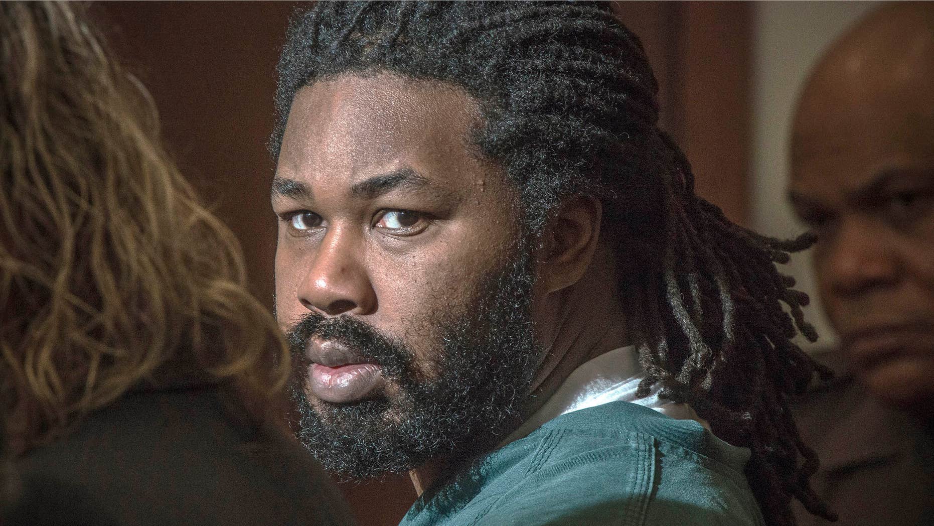 Nov. 14, 2014 photo shows Jesse Matthew Jr., right, looking toward the gallery in Fairfax, Va., courtroom.