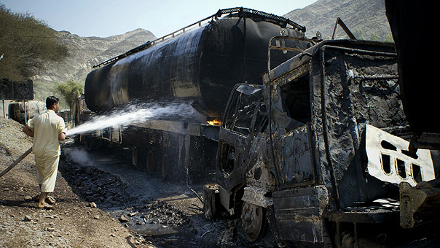 Sept. 24: A fire is extinguished after militants attacked oil tankers for NATO forces, in Khyber near Peshawar, Pakistan.
