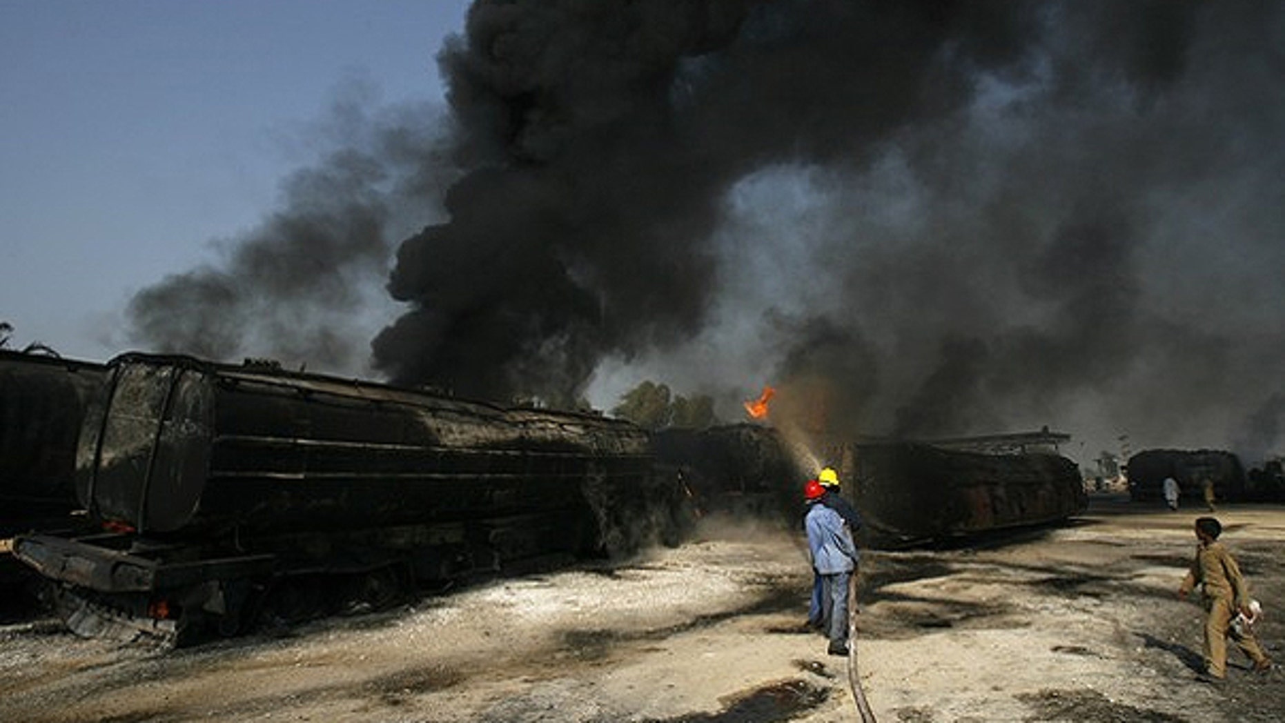 Oct. 1: Firemen extinguish a fire on a burning oil tanker on a highway near Shikarpur, in Pakistan's Sindh province. Suspected militants set fire to tankers carrying fuel for NATO troops in Afghanistan.