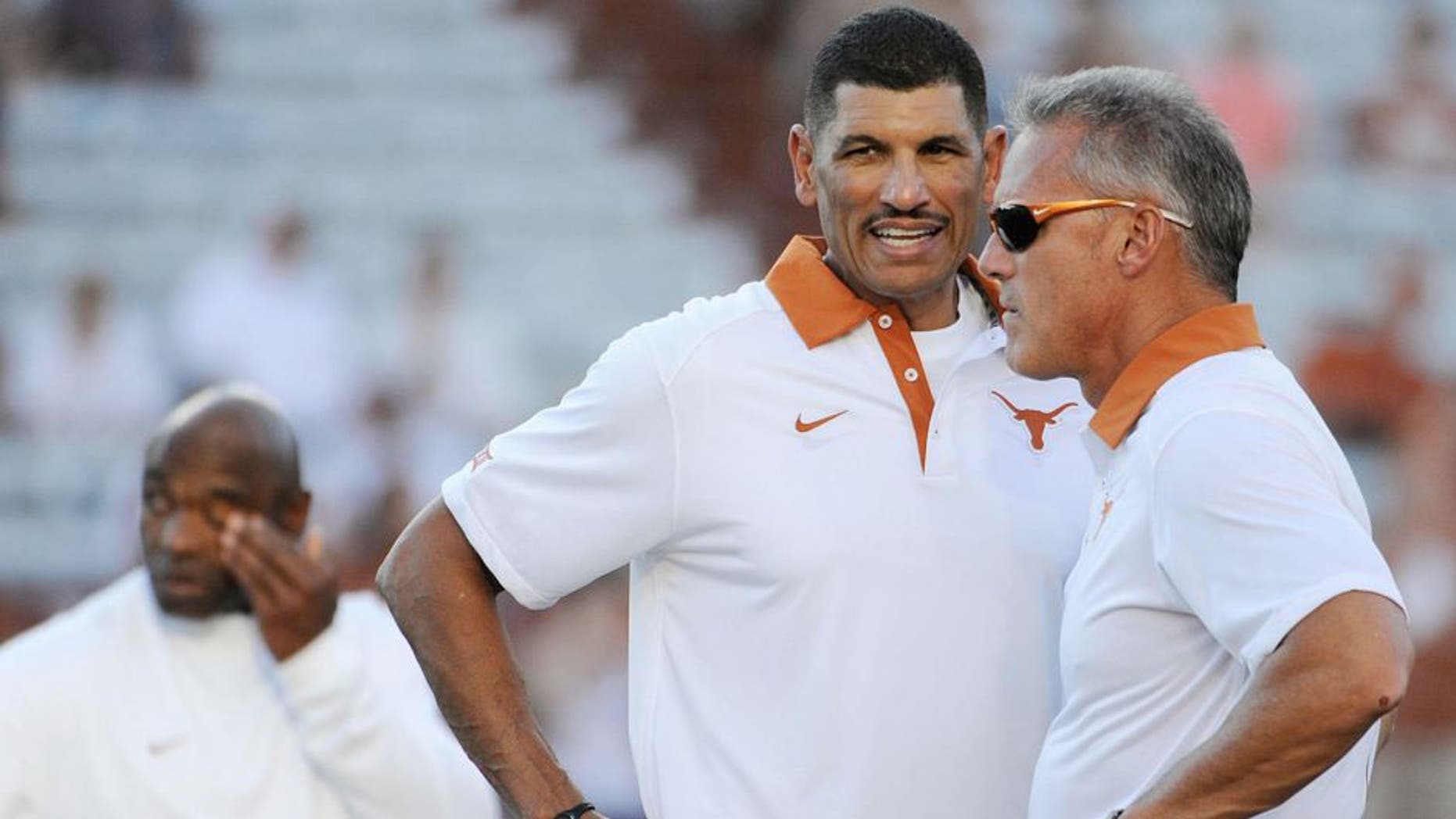 Sep 12, 2015; Austin, TX, USA; Texas Longhorns wide receivers coach Jay Norvell (left) talks with quarterbacks coach Shawn Watson (right) prior to kick off against the Rice Owls at Darrell K Royal-Texas Memorial Stadium. Texas beat Rice 42-28. Mandatory Credit: Brendan Maloney-USA TODAY Sports