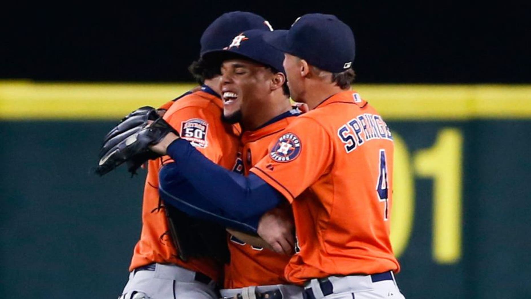 Sep 30, 2015; Seattle, WA, USA; Houston Astros center fielder Carlos Gomez (30) celebrates with left fielder Jake Marisnick (6) and right fielder George Springer (4) after making an outfield assist for a double play to end a 7-6 victory against the Seattle Mariners at Safeco Field. Mandatory Credit: Joe Nicholson-USA TODAY Sports