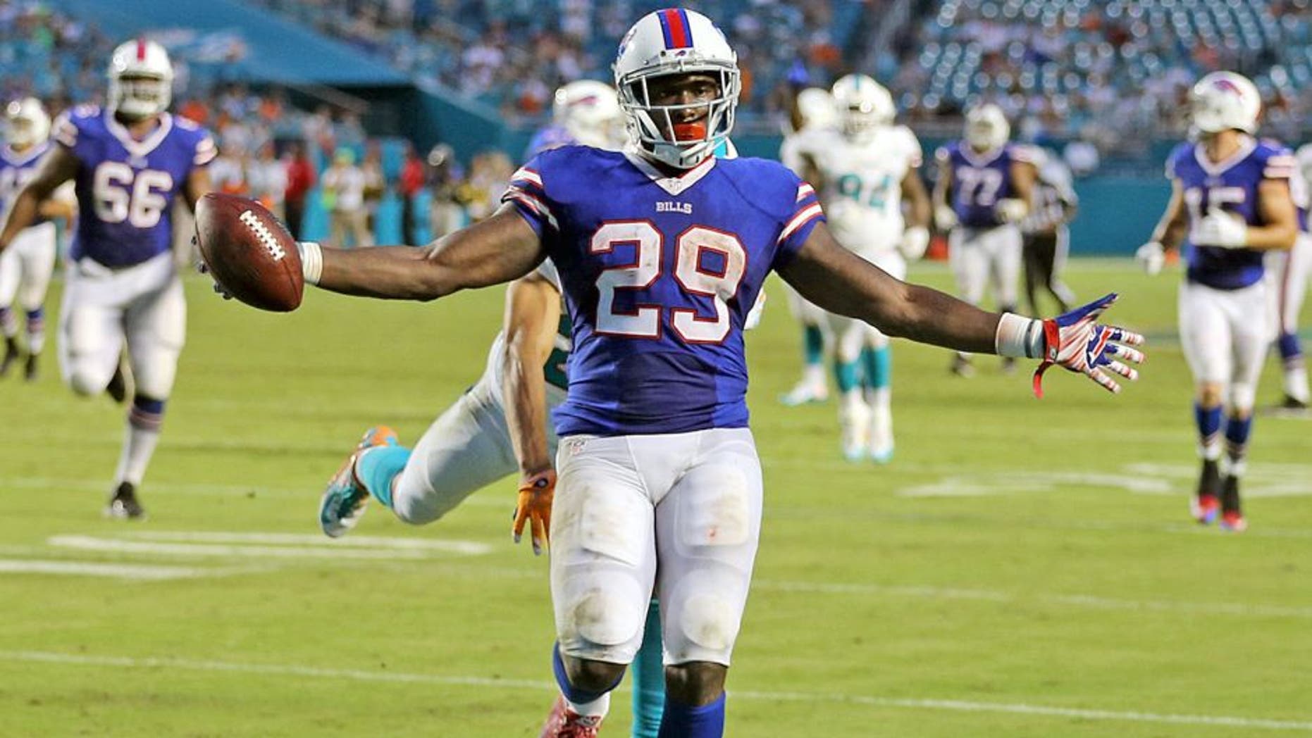 The Miami Dolphins defense fails to stop Buffalo Bills' Karlos Williams as he scores a touchdown during the fourth quarter on Sunday, Sept. 27, 2015, at Sun Life Stadium in Miami Gardens, Fla. (Charles Trainor Jr./Miami Herald/TNS via Getty Images)