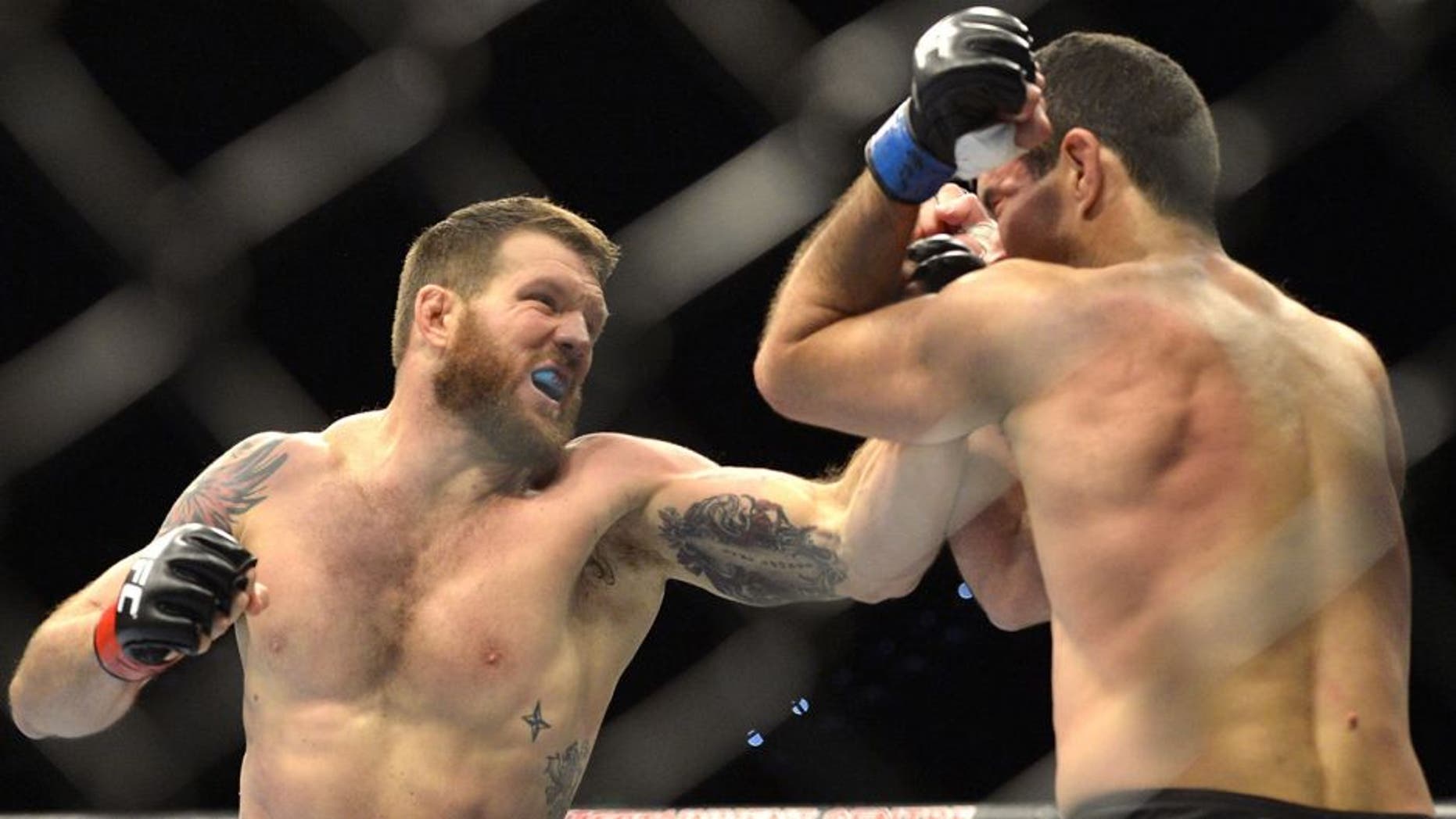 BRISBANE, AUSTRALIA - DECEMBER 07: Ryan Bader of the USA punches Anthony Perosh of Australia during their UFC Fight Night Brisbane bout at the Brisbane Entertainment Centre on December 7, 2013 in Brisbane, Australia. (Photo by Bradley Kanaris/Getty Images)