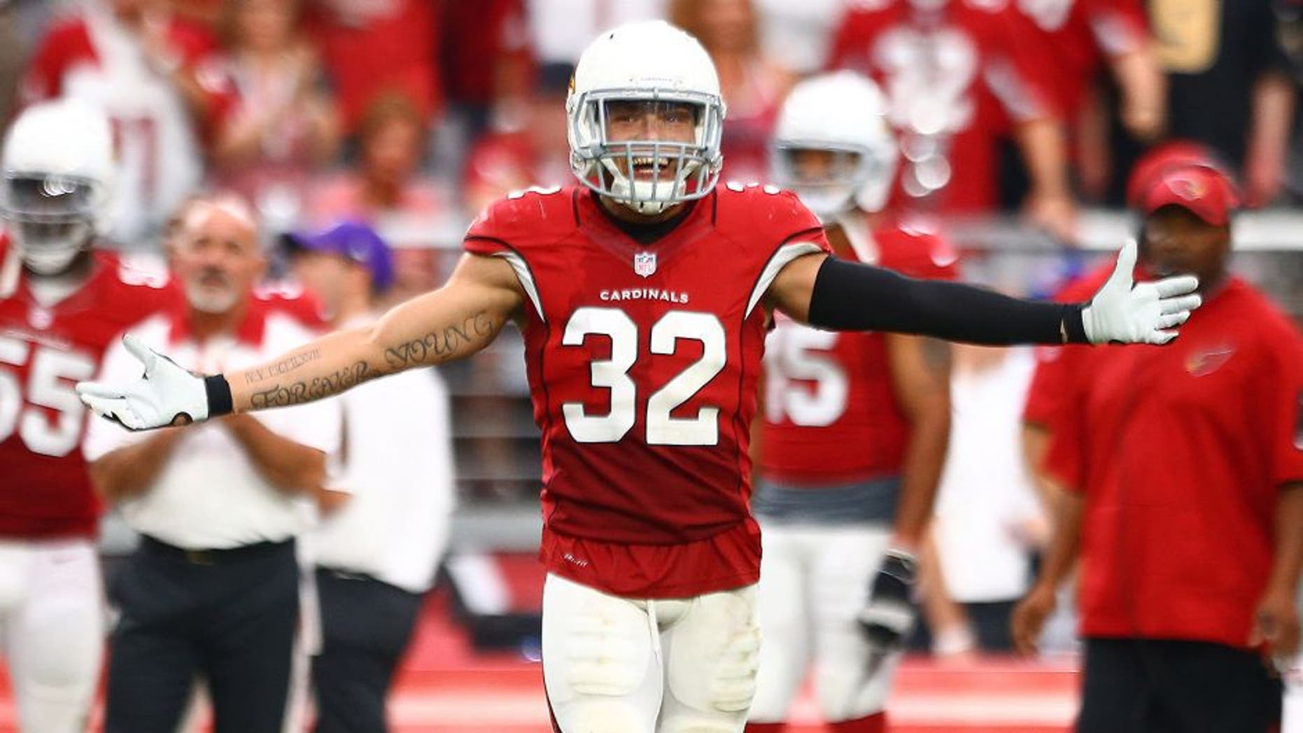 Sep 13, 2015; Glendale, AZ, USA; Arizona Cardinals safety Tyrann Mathieu (32) celebrates a play in the fourth quarter against the New Orleans Saints at University of Phoenix Stadium. The Cardinals defeated the Saints 31-19. Mandatory Credit: Mark J. Rebilas-USA TODAY Sports