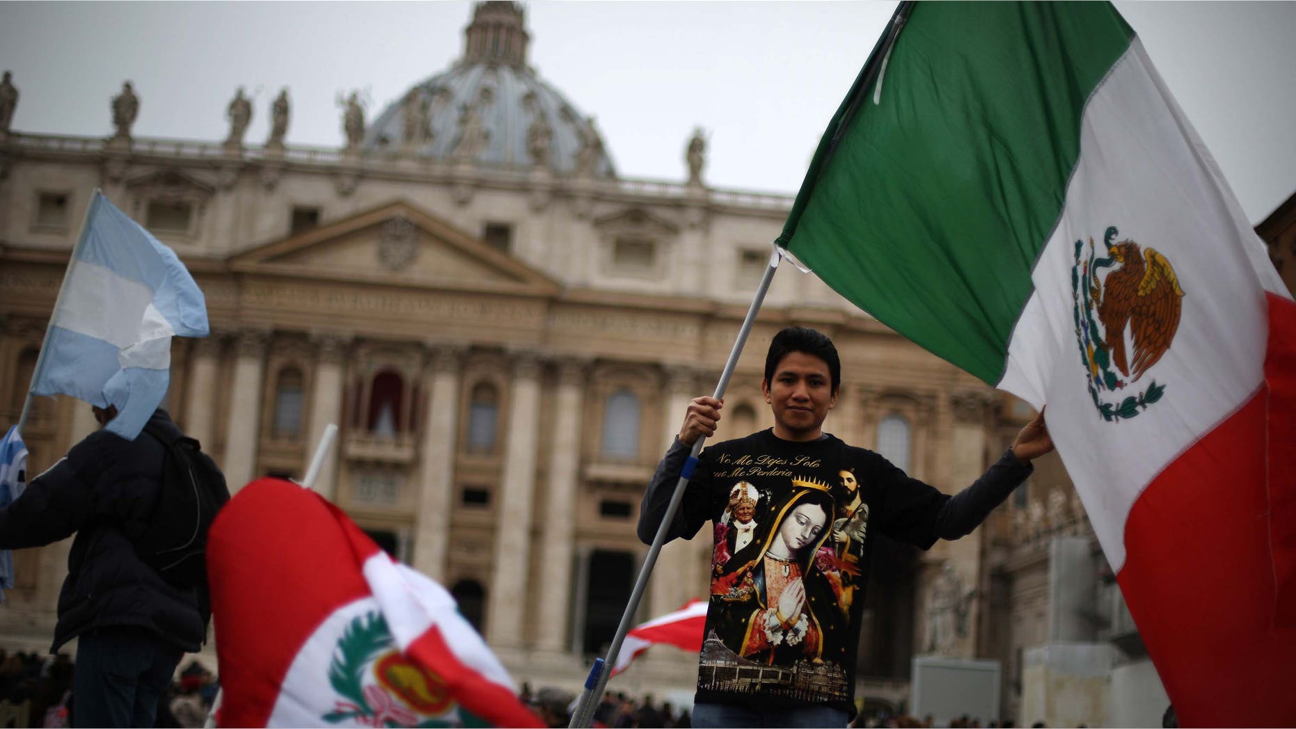 VATICAN CITY, VATICAN - MARCH 17: A boy waves the flag of Mexico in St Peter's Square after Pope Francis gave his first Angelus blessing on March 17, 2013 in Vatican City, Vatican. The Vatican is preparing for the inauguration of Pope Francis on March 19, 2013 in St Peter's Square. (Photo by Peter Macdiarmid/Getty Images)