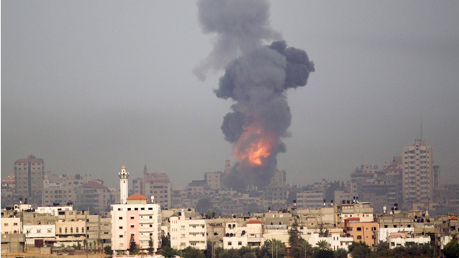Nov. 17, 2012: Explosion and smoke rise following an Israeli strike in Gaza, seen from the Israel Gaza Border, southern Israel.