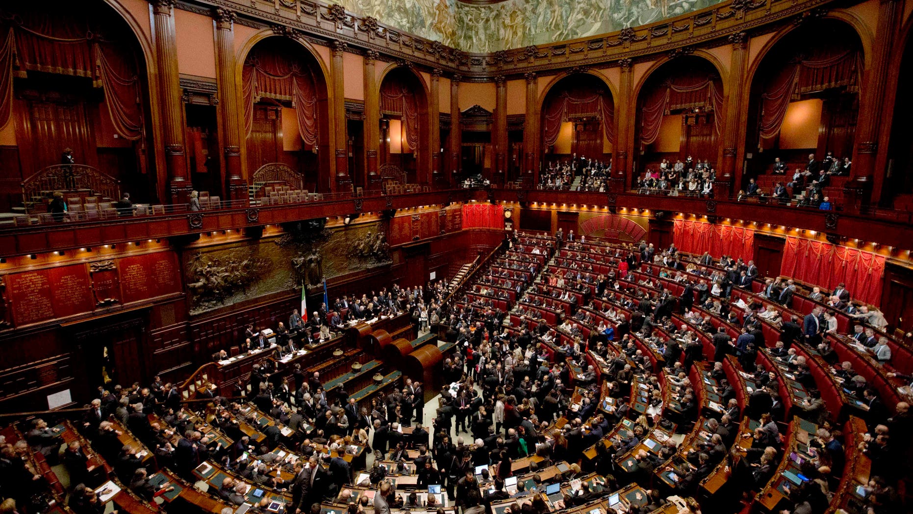 Italian lawmakers gather to vote on a new president whose first job will be to seek the formation of a new government after inconclusive elections, in Rome Thursday, April 18, 2013. Political parties sparred over suitable candidates for the post being vacated by Giorgio Napolitano ahead of the Thursday vote, reflecting divisions that they have been unable to overcome in the more than 50 days since the Feb. 24-25 elections. Napolitano's term expires next month. (AP Photo/Alessandra Tarantino)