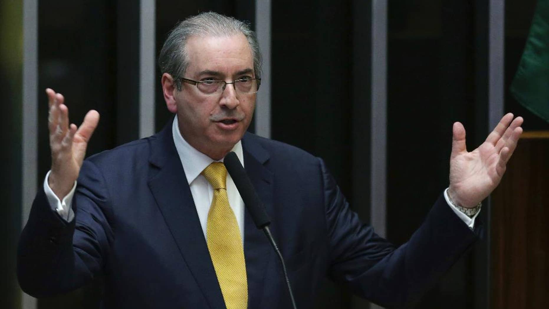 FILE - In this Sept. 12, 2016 file photo, former Congressman Eduardo Cunha speaks during the presentation of his defense in the Chamber of Deputies, in Brasilia, Brazil. A judge sentenced Cunha on Thursday, March 30 2017, to 15 years in a corruption scheme at state-run oil giant Petrobras. Cunha was speaker of Brazil’s lower house when he opened impeachment proceedings against President Dilma Rousseff on charges of manipulating the fiscal budget. (AP Photo/Eraldo Peres, File)