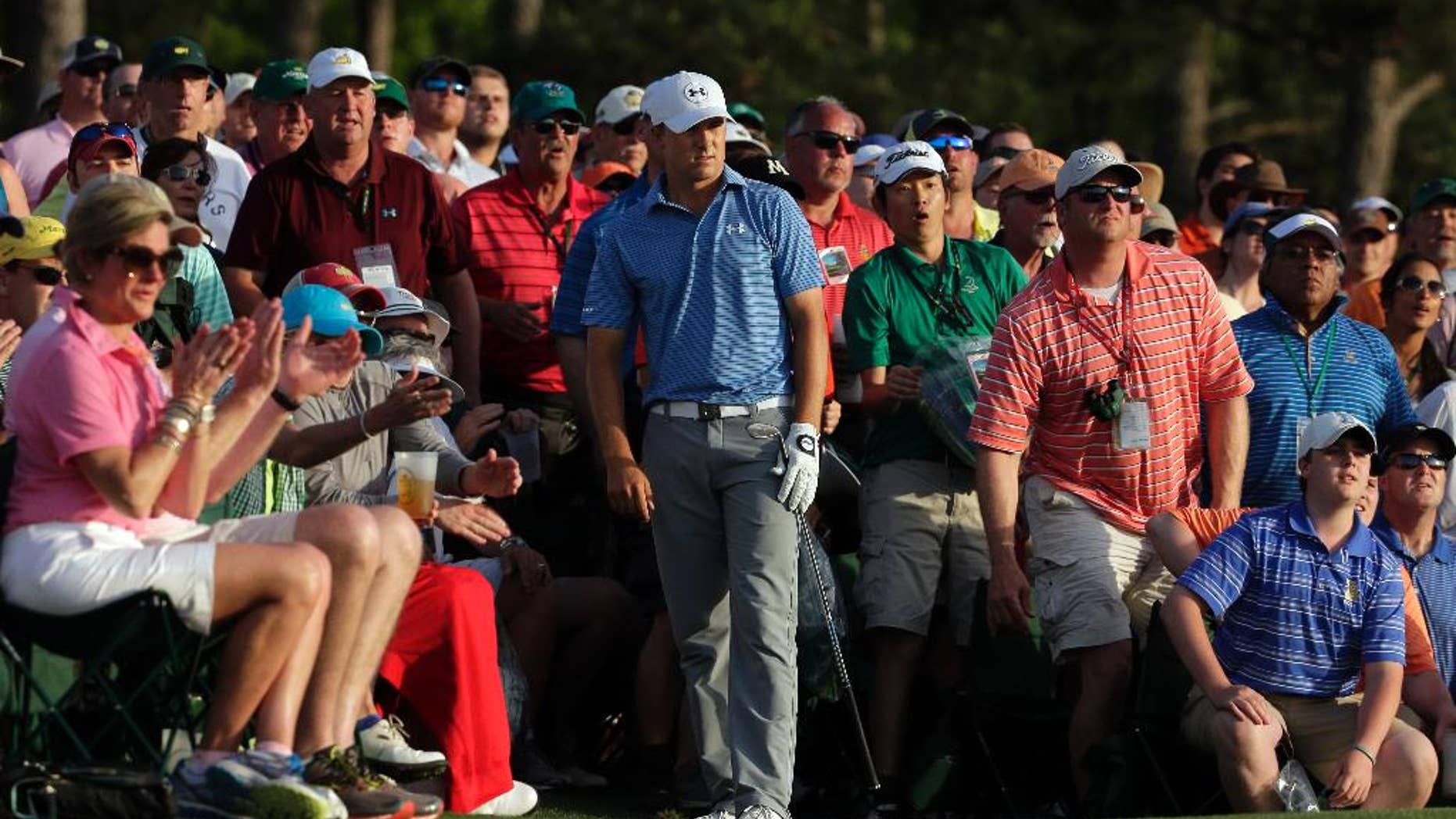 Jordan Spieth watches his hit out of the gallery on the 18th hole during the third round of the Masters golf tournament Saturday, April 11, 2015, in Augusta, Ga. (AP Photo/Chris Carlson)