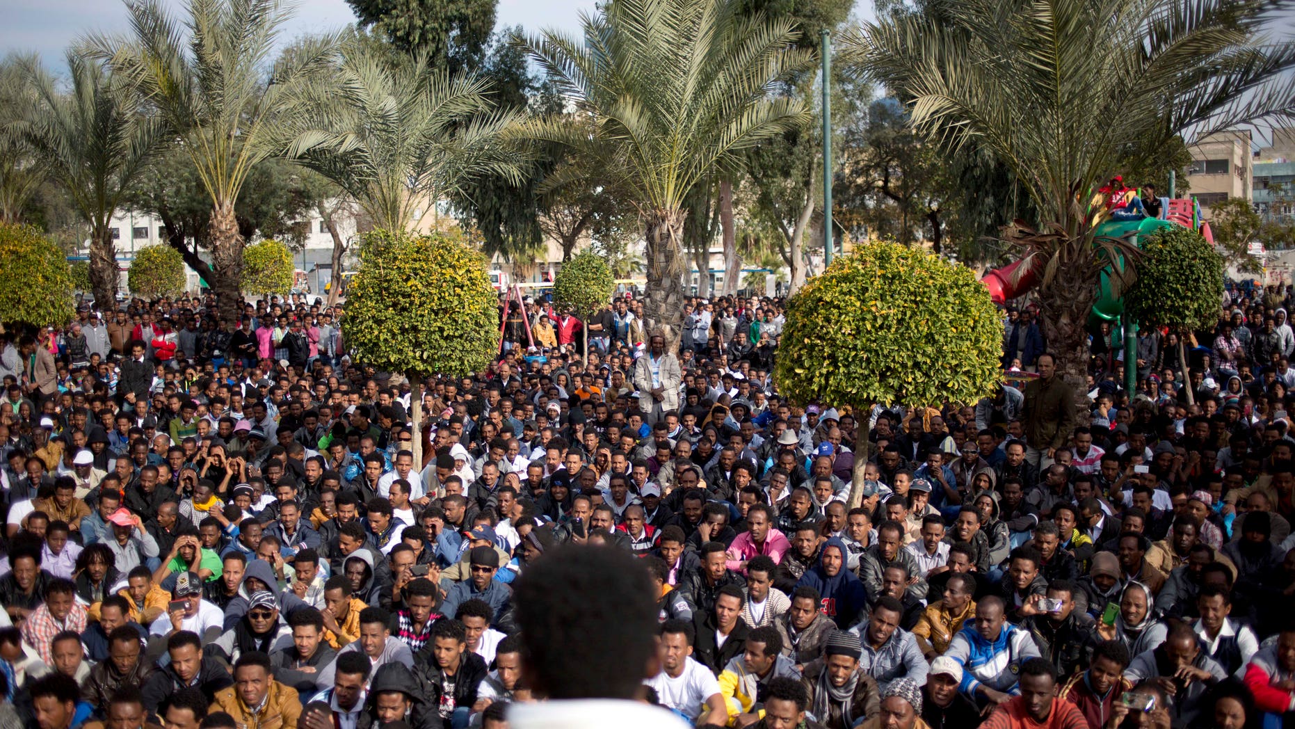 African migrants gather during a protest in Lewinsky park in Tel Aviv, Israel, Tuesday, Jan. 7, 2014. The migrants, some of whom are menial laborers in Israel, have been on a three-day strike. About 60,000 African migrants, mostly from Sudan and Eritrea, have trekked through Egypt and other Muslim countries to reach Israel in recent years. Some are fleeing violence or oppression in their home countries while others are seeking better economic opportunities. (AP Photo/Ariel Schalit)