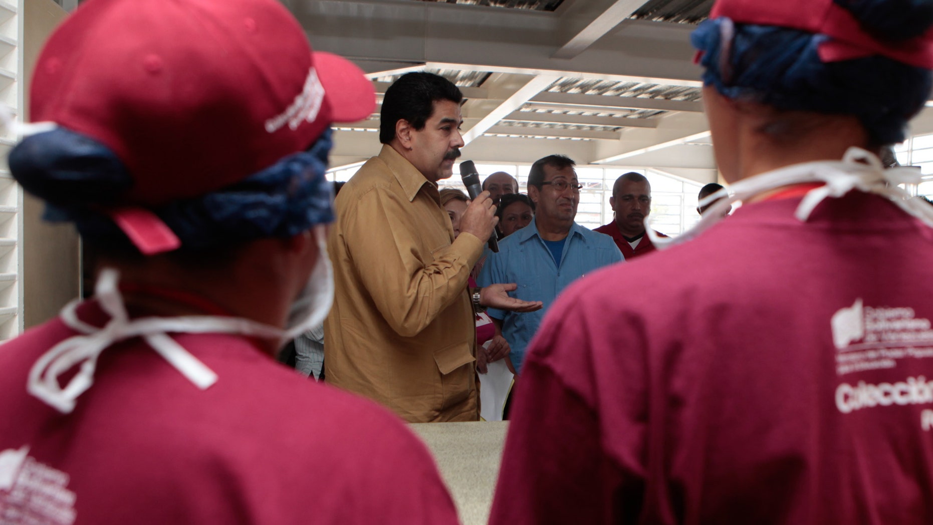 Jan. 18, 2013: In this photo released by Miraflores Press Office, Venezuela's Vice President Nicolas Maduro, center, speaks to students during the inauguration of a school in Barinas, Venezuela.