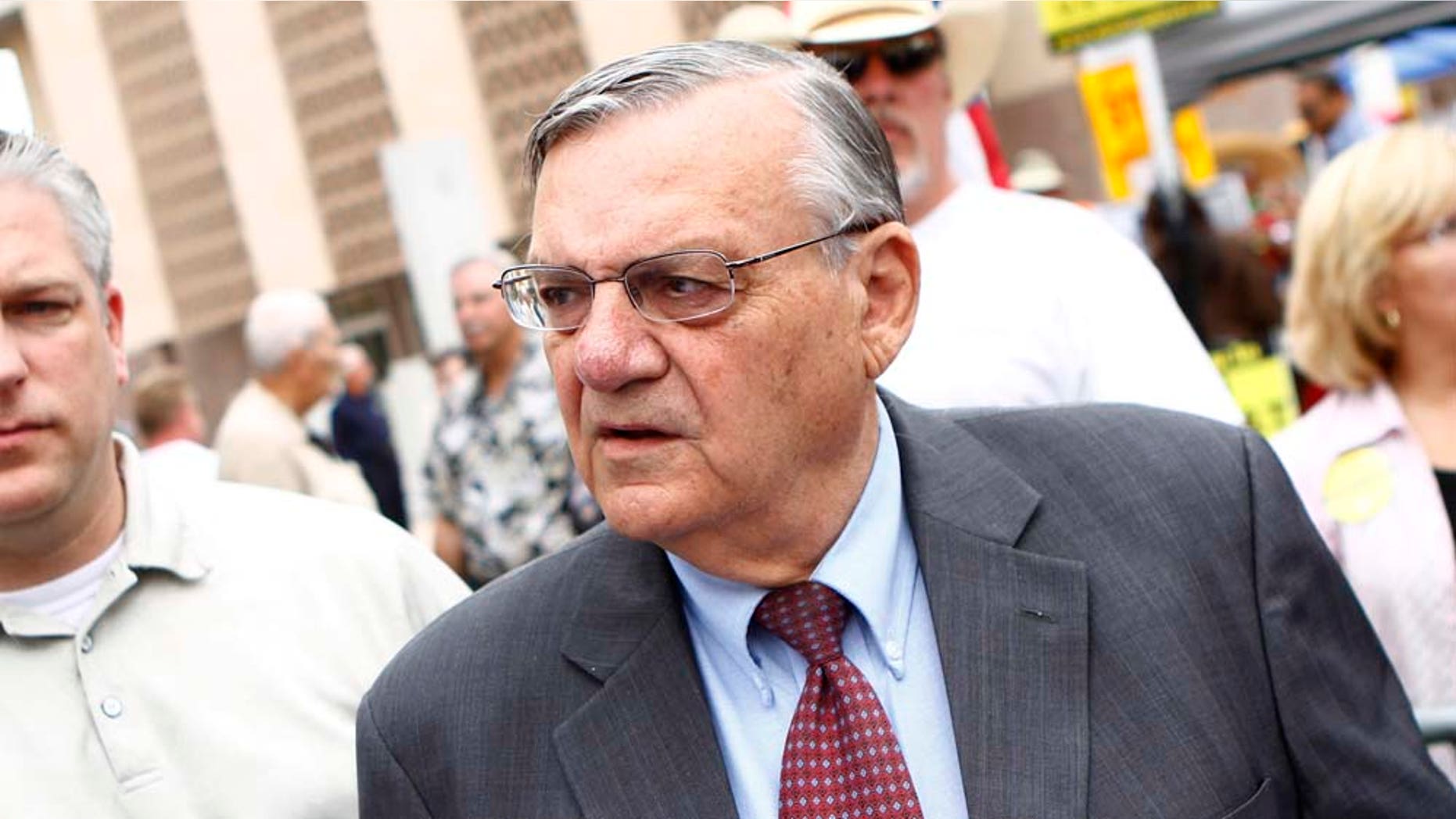 PHOENIX, AZ - OCTOBER 22: Maricopa County Sheriff Joe Arpaio (R) attends a rally for the Tea Party Express national tour October 22, 2010 in Phoenix, Arizona. The tour, part of an initiative to get conservatives elected to the House and Senate, will move across country and conclude on November 1, 2010 in Concord, New Hampshire the day before the contentious mid-term elections. (Photo by Joshua Lott/Getty Images)