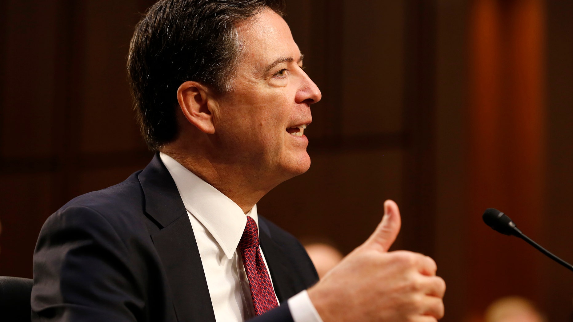 Former FBI Director James Comey testifies before the Senate Intelligence Committee on Capitol Hill, Washington, DC, 6-8-17.