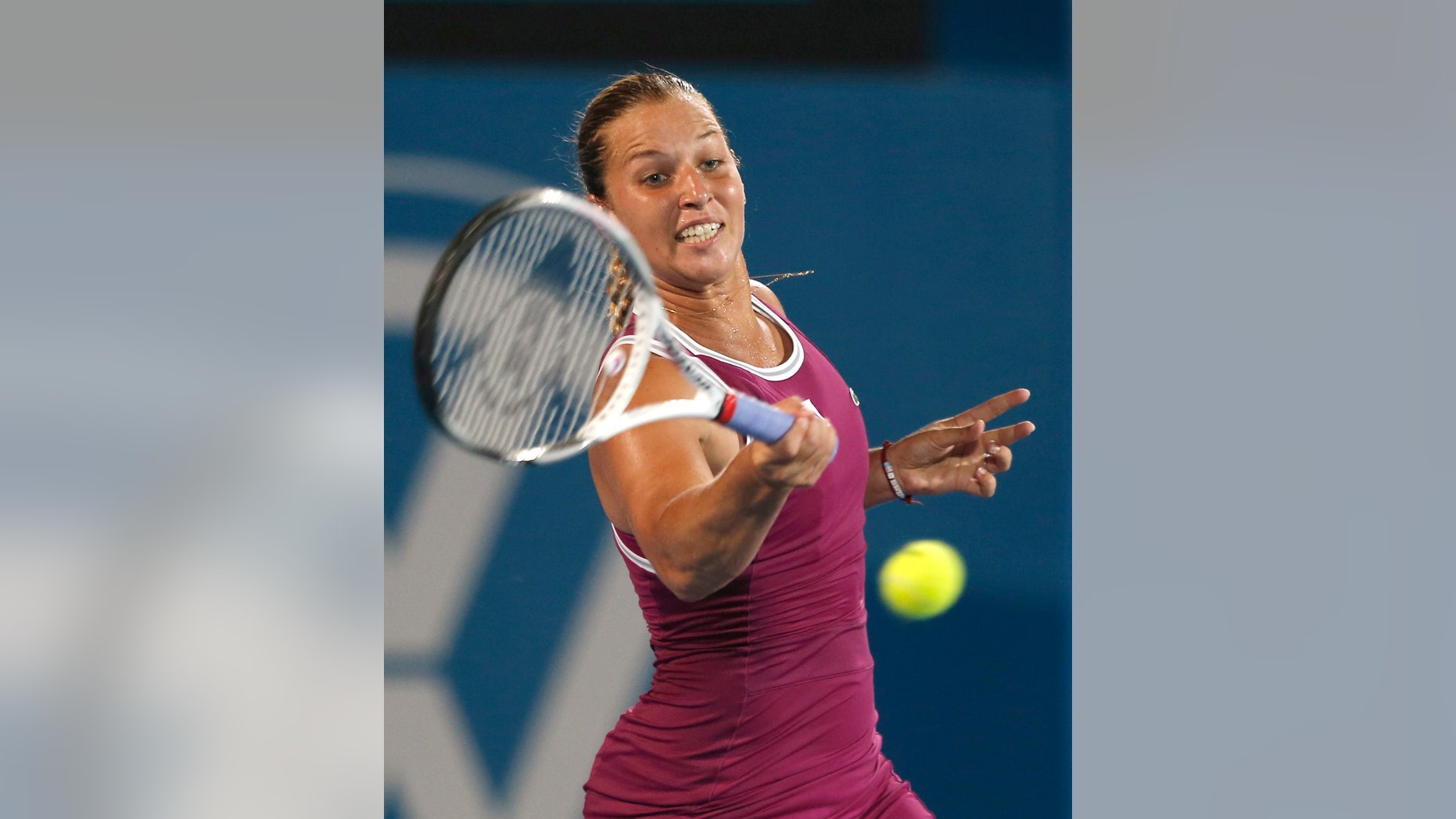 Slovakia's Dominika Cibulkova returns a shot to Poland's Agnieszka Radwanska during the women's final of the Sydney International tennis tournament in Sydney, Australia, Friday, Jan. 11, 2013. Radwanska won the match 6-0, 6-0. (AP Photo/Rob Griffith)