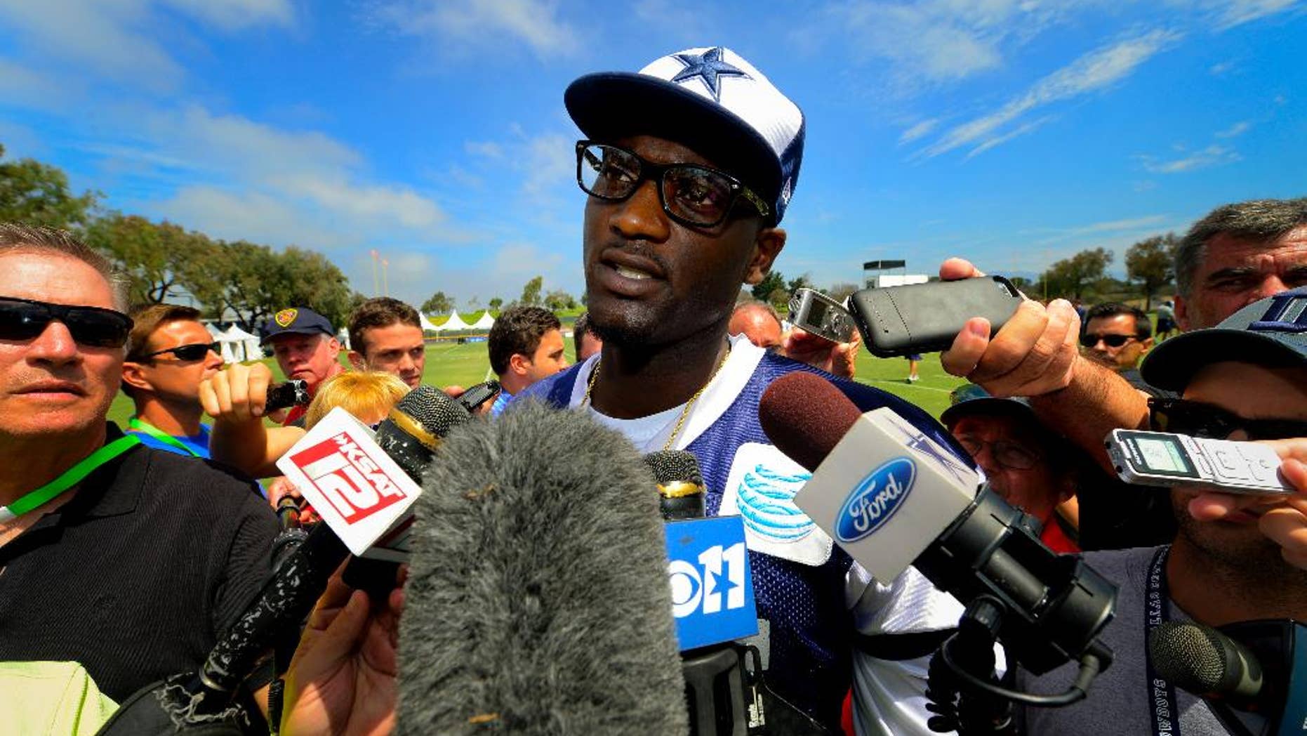 Dallas Cowboys linebacker Rolando McClain talks with the press at the end of morning practice after his first day of practice since his retirement during an NFL training camp, Saturday, July 26, 2014, in Oxnard, Calif. (AP Photo/Gus Ruelas)