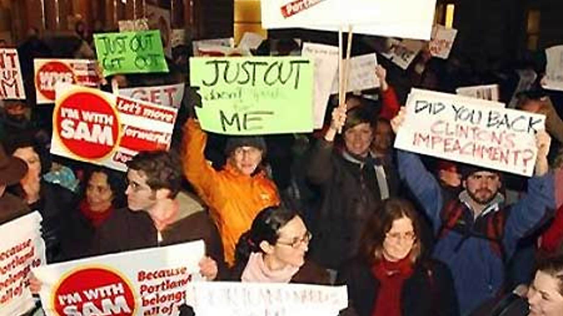Jan. 23: Hundreds of people gather outside City Hall holding signs and chanting their support for Portland mayor Sam Adams at a rally in Oregon.