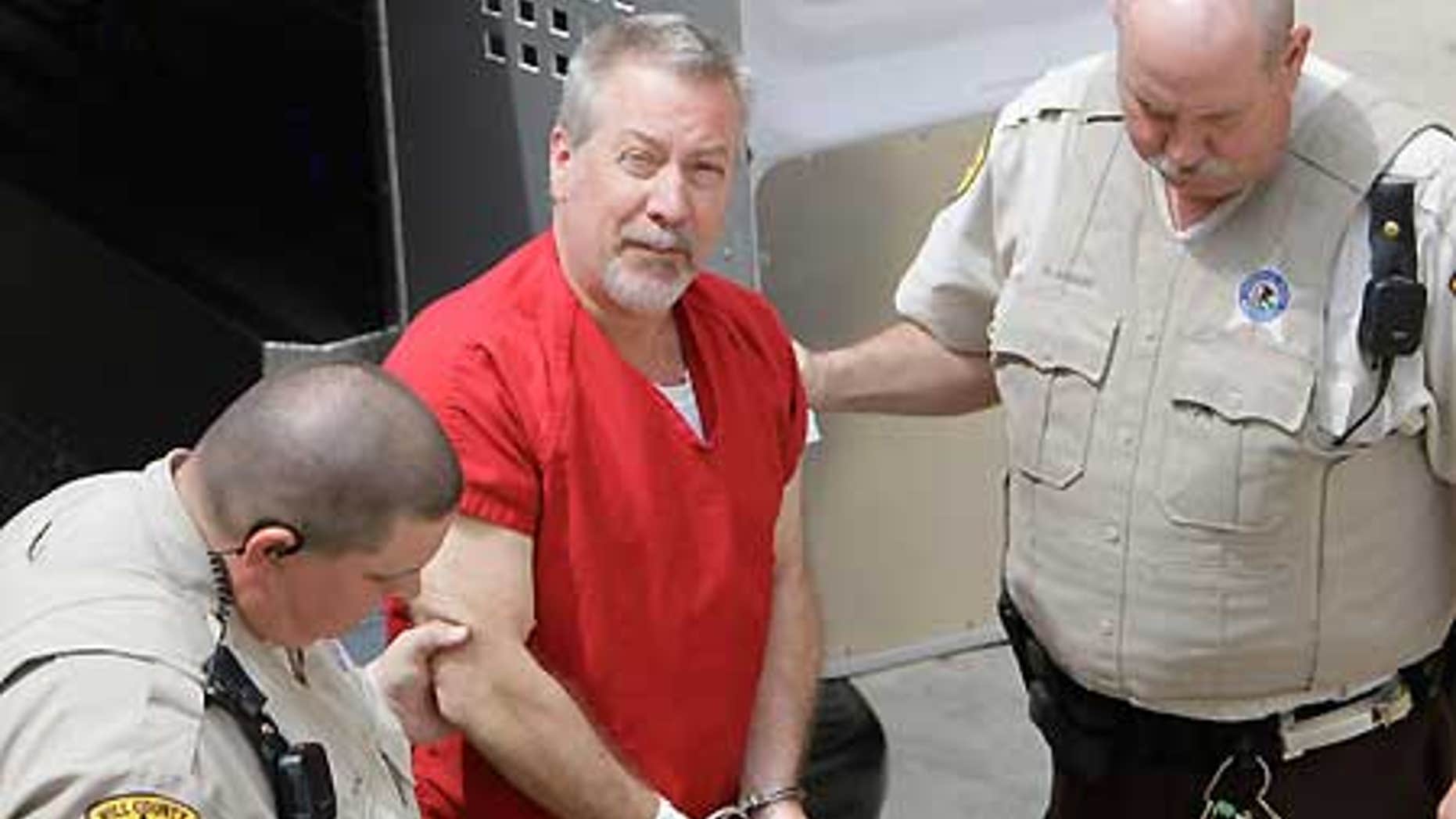 File photo shows former Bolingbrook, Ill. police Sgt. Drew Peterson arriving at the Will County Courthouse in Joliet, Ill.