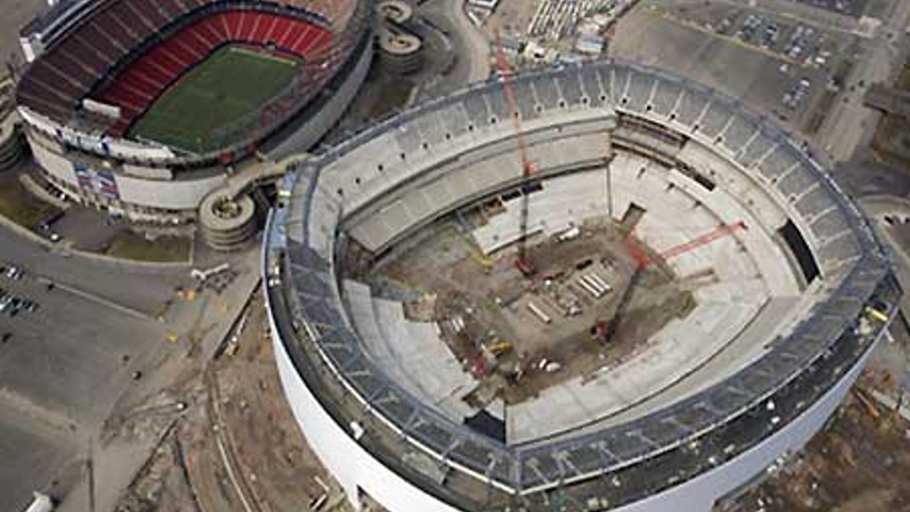 March 22: The under-construction Giants Stadium, right, and the older and still in use Giants Stadium, left.