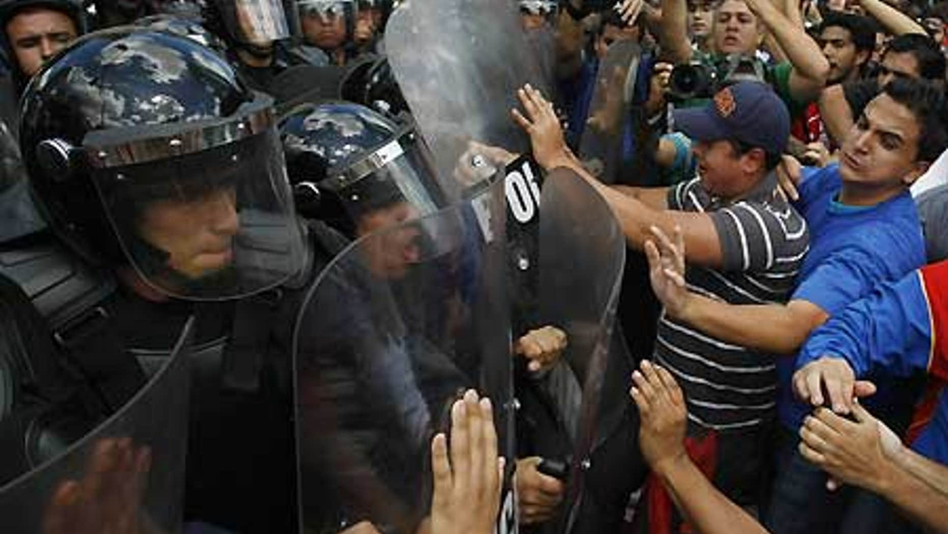 Feb. 4: University students clash with police during a protest against Venezuela's President Hugo Chavez in Caracas.