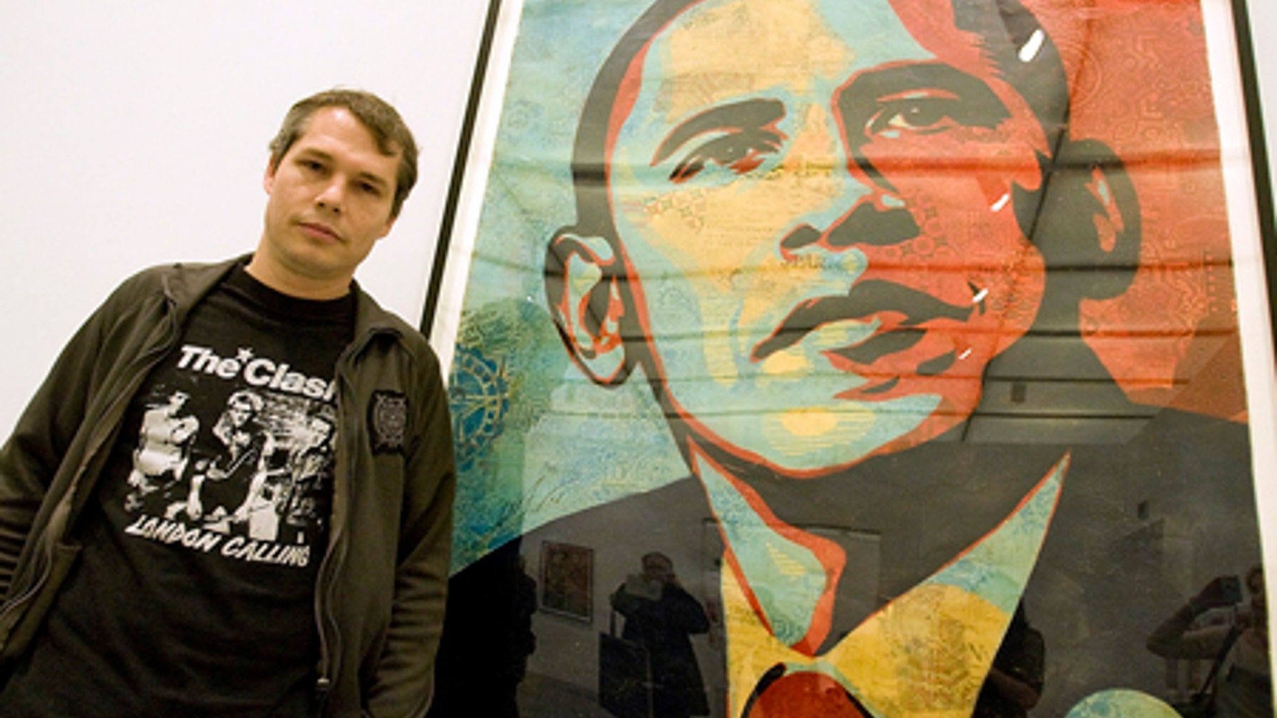 Feb. 3, 2009: Artist Shepard Fairey poses beside his "Obama HOPE" image, part of an exhibit of his work at the Institute of Contemporary Art.