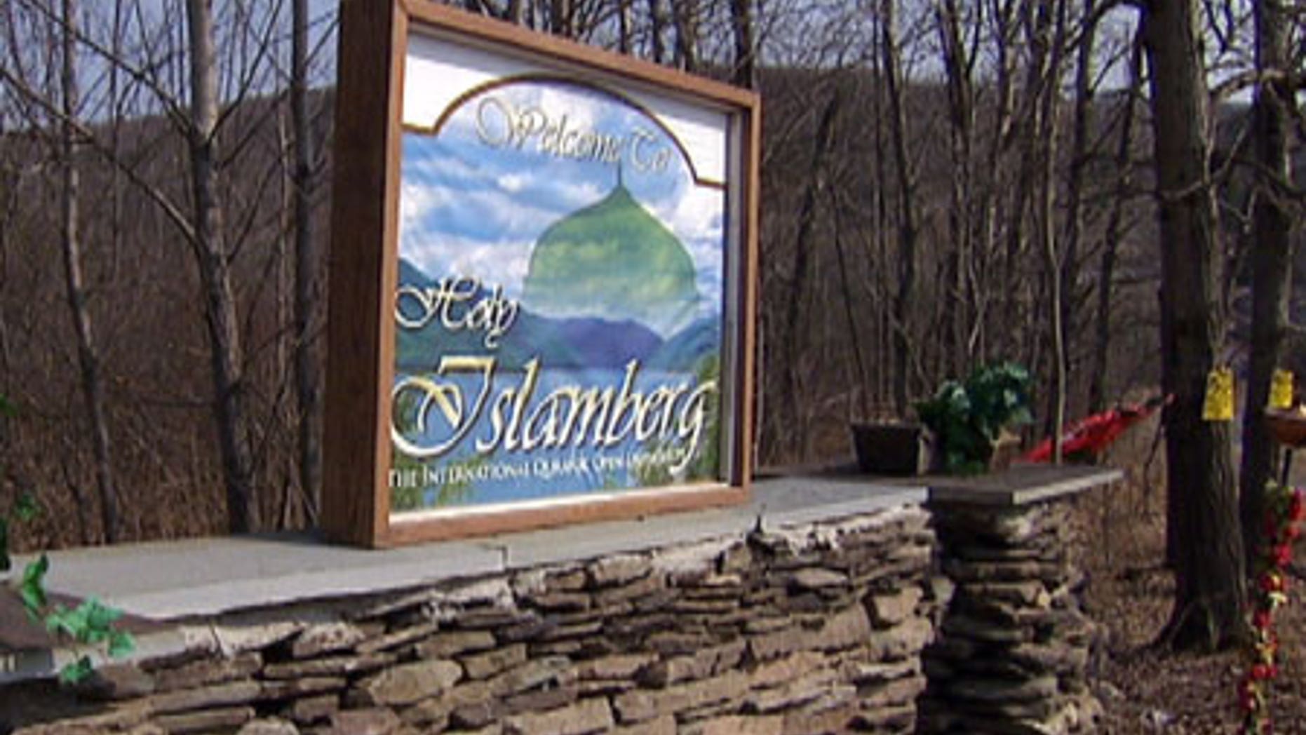 The gate to Islamberg, N.Y., a private Muslim community that is home to an estimated 100 residents. The sign reads: 'Welcome to Holy Islamberg, The International Quranic Open University.'