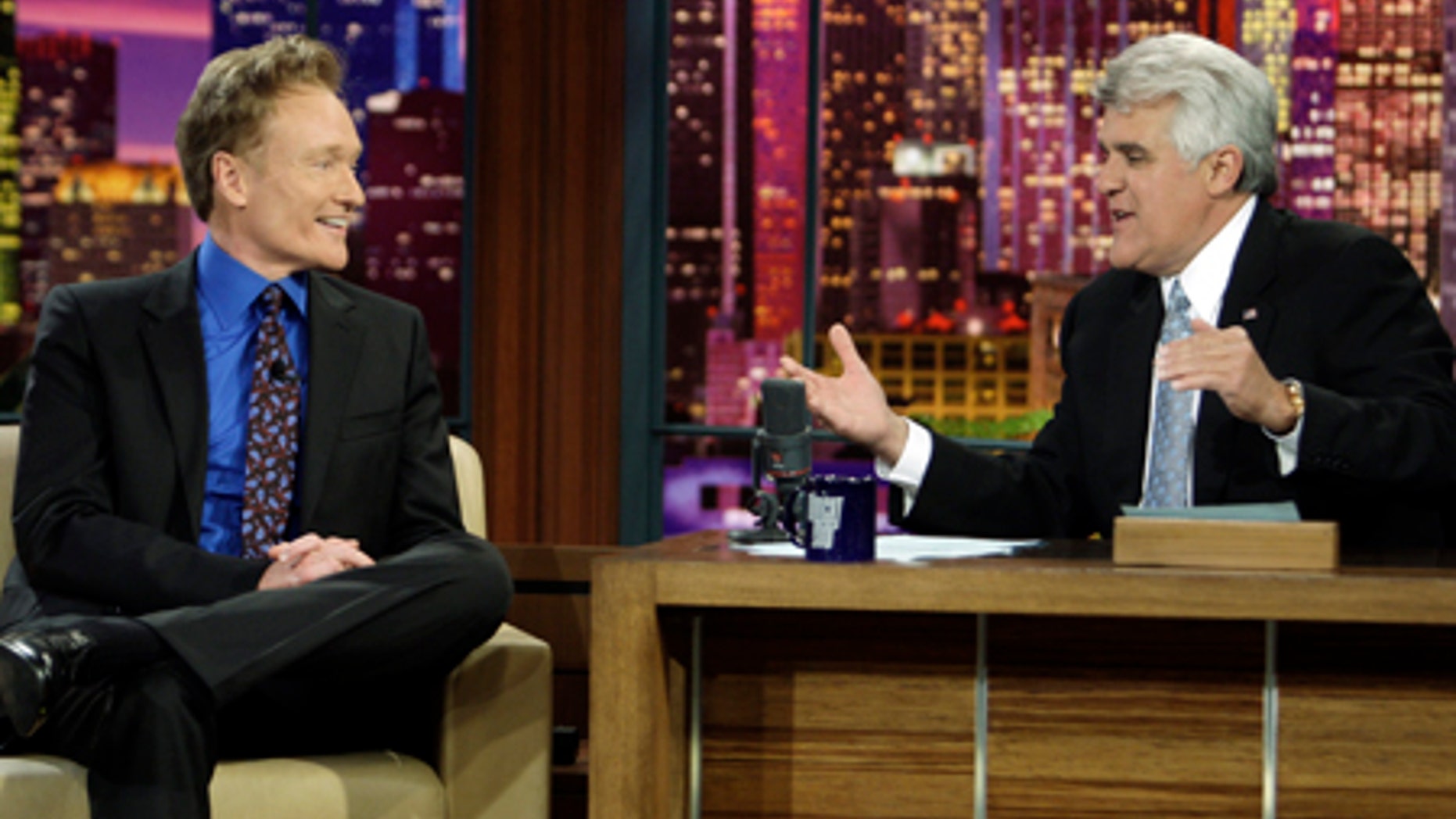 In this photo provided by NBC, Conan O'Brien interviewed by Jay Leno during Leno's final taping as host of The Tonight Show in Burbank, Calif. on Friday, May 29, 2009. (AP Photo/NBC, Paul Drinkwater) **MAGS OUT, NO ARCHIVING, NO SALES**