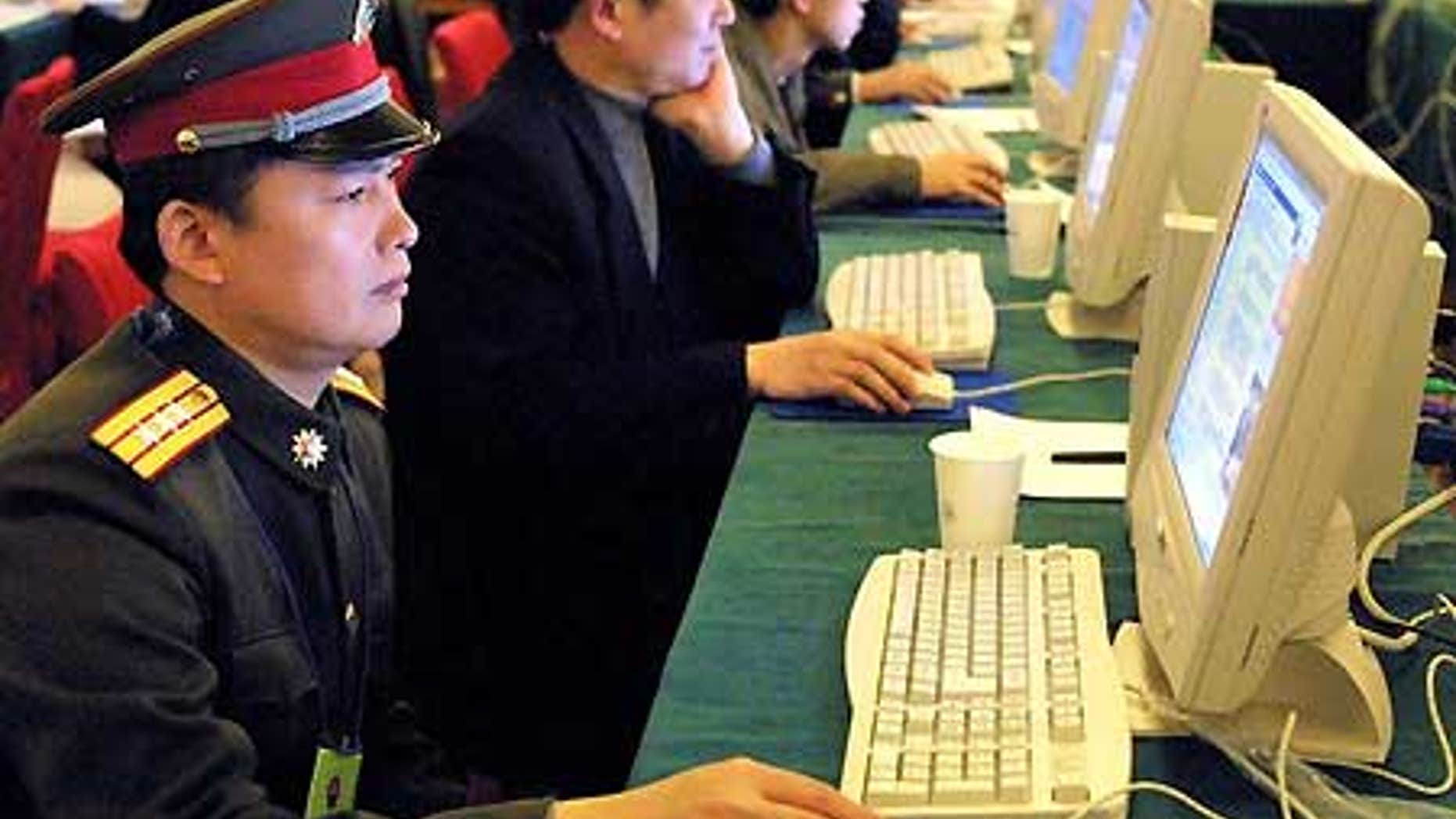 FILE: A Chinese military officer surfs the Internet in Beijing. China is engaged in a high-profile fight with Google as part of an effort to stifle dissent ahead of its 60th anniversary this fall.