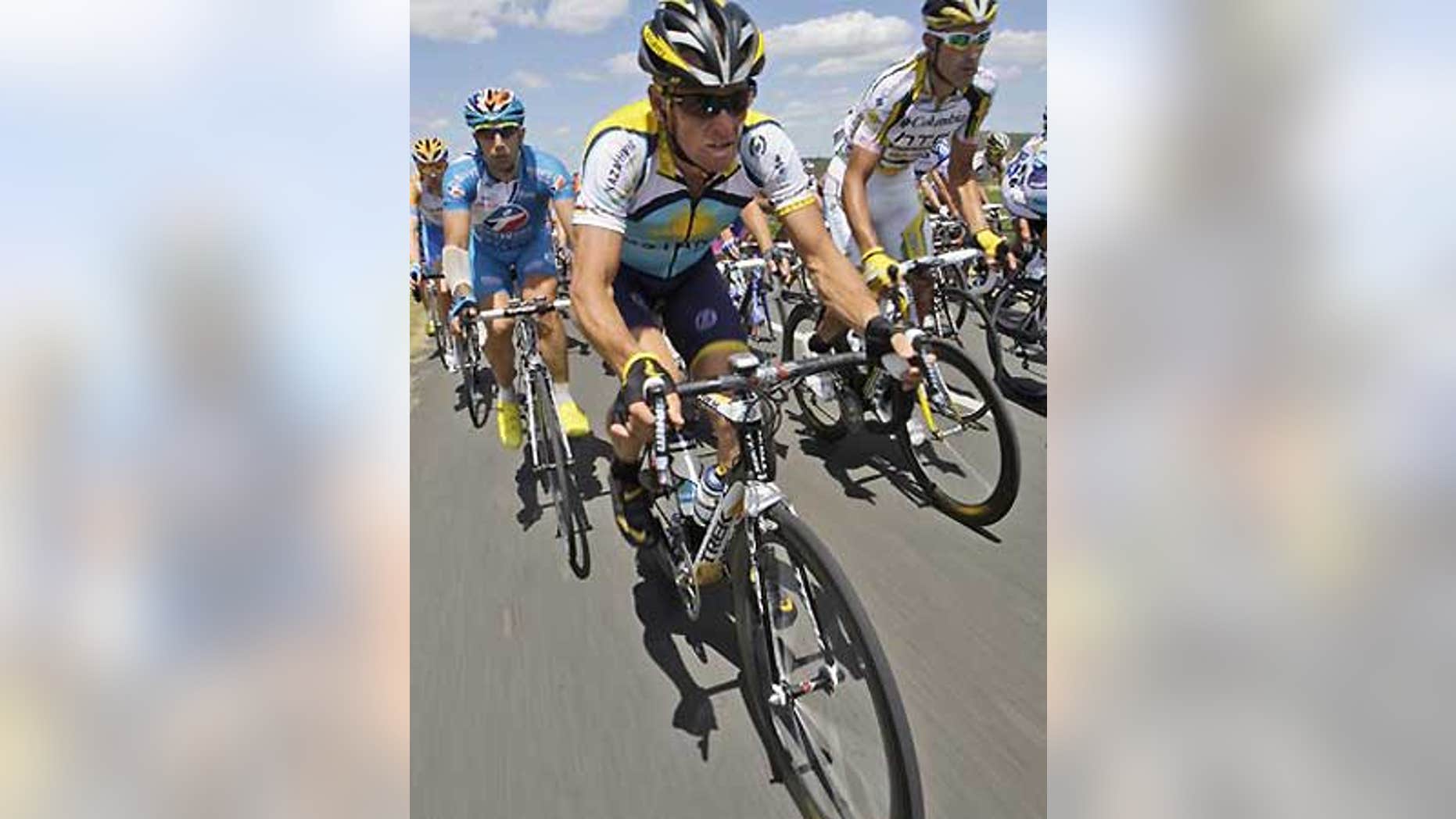 American 7-time Tour de France winner Lance Armstrong peddles in the pack during the Tour de France cycling race, July 7, in Perpignan, France.