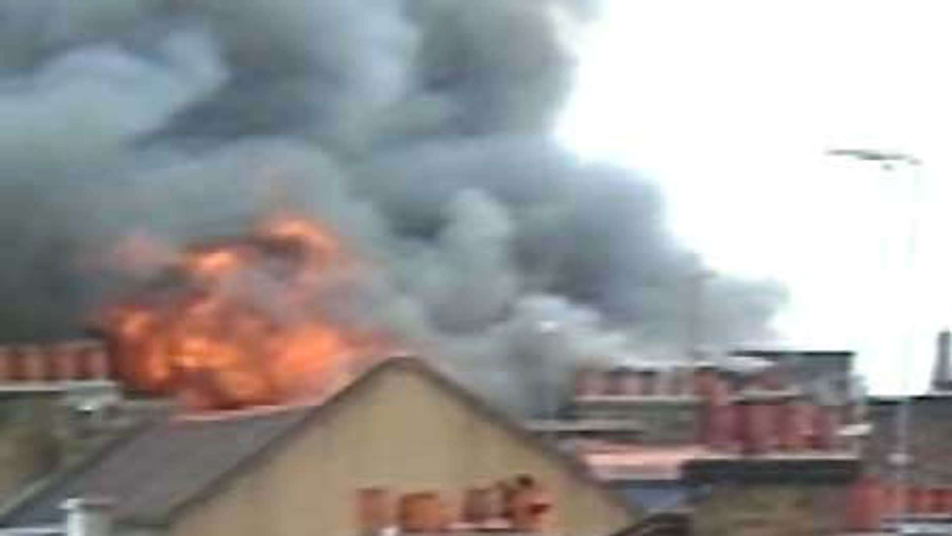 July 10: 60 firefighters battle an apartment building fire in Soho, London.