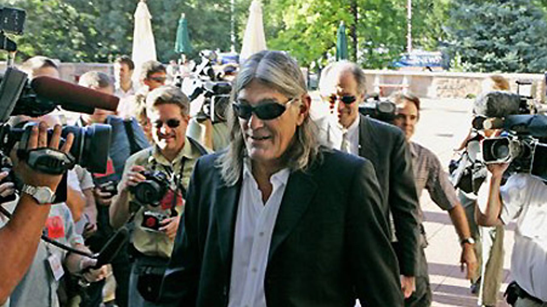 July 24: Ward Churchill arrives at a meeting with the Board of Regents