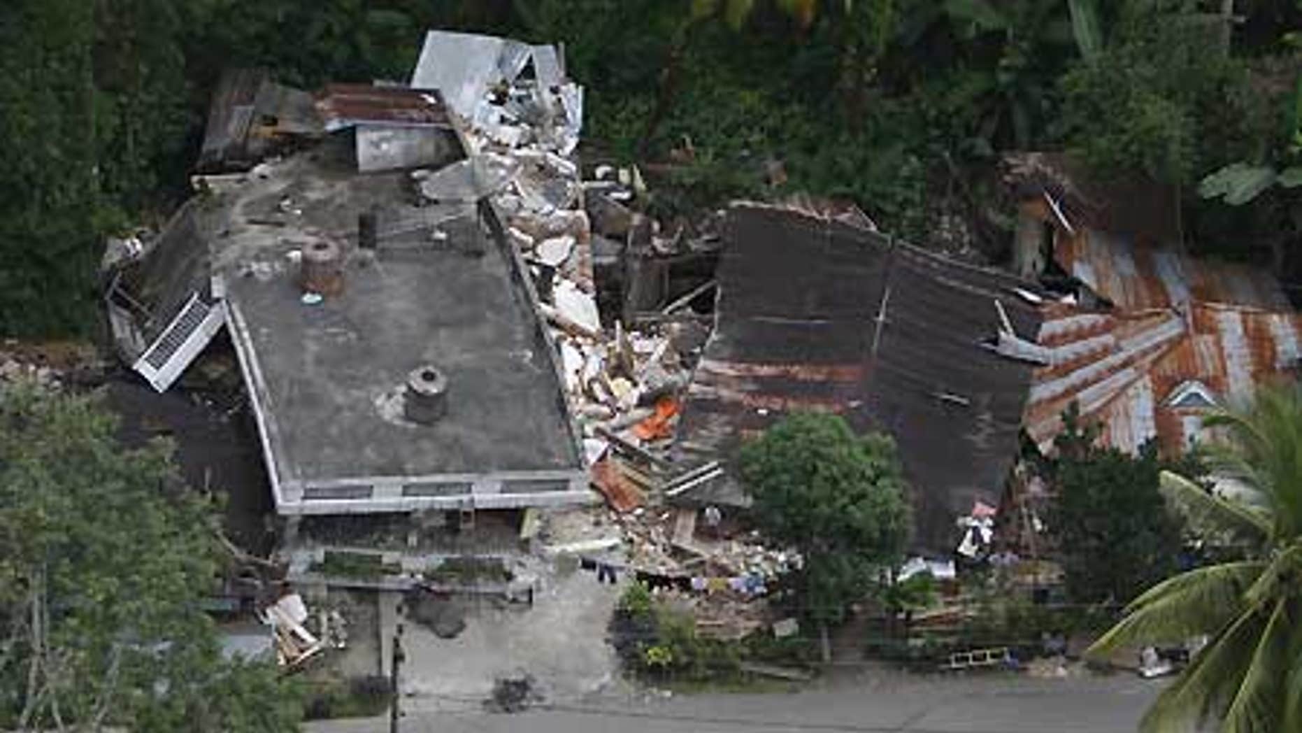 Oct. 3: Damaged houses are seen in this aerial image of an area affected by earthquake-triggered landslide in Padang Pariaman, West Sumatra.