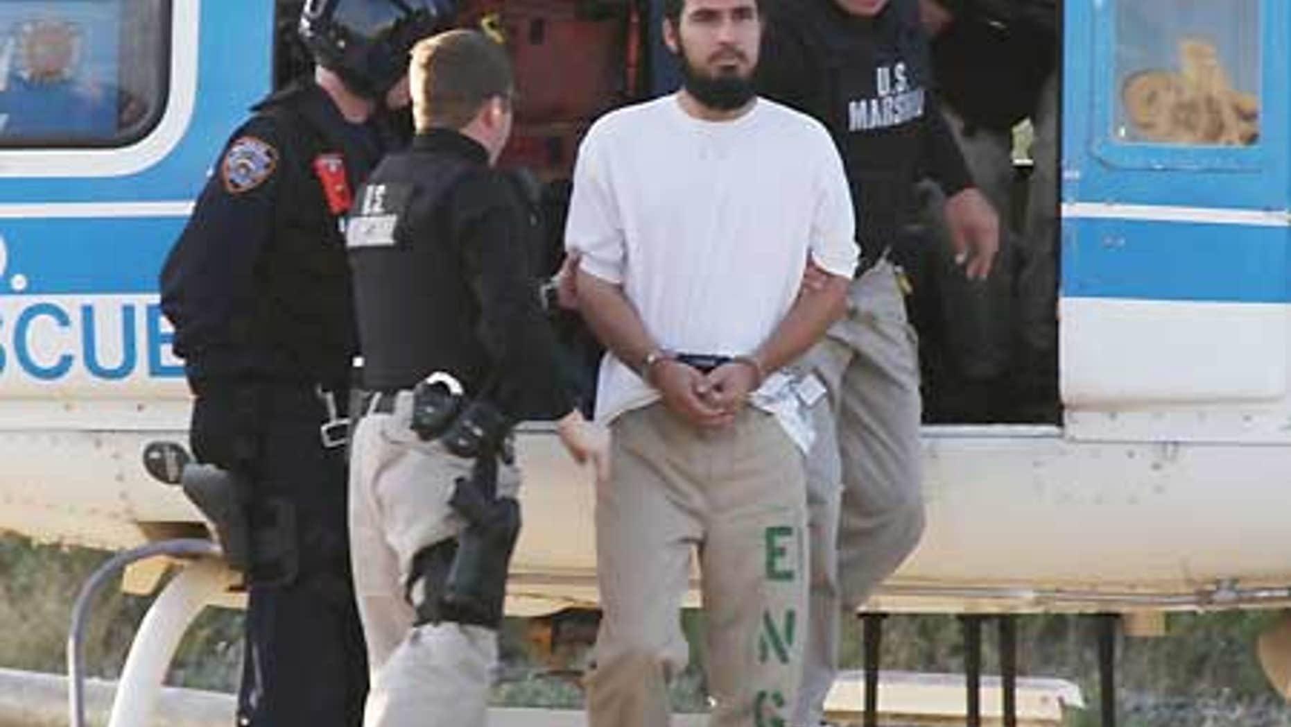 Sept. 25: Najibullah Zazi, center, is escorted off an NYPD helicopter by U.S Marshals after being extradited from Denver.