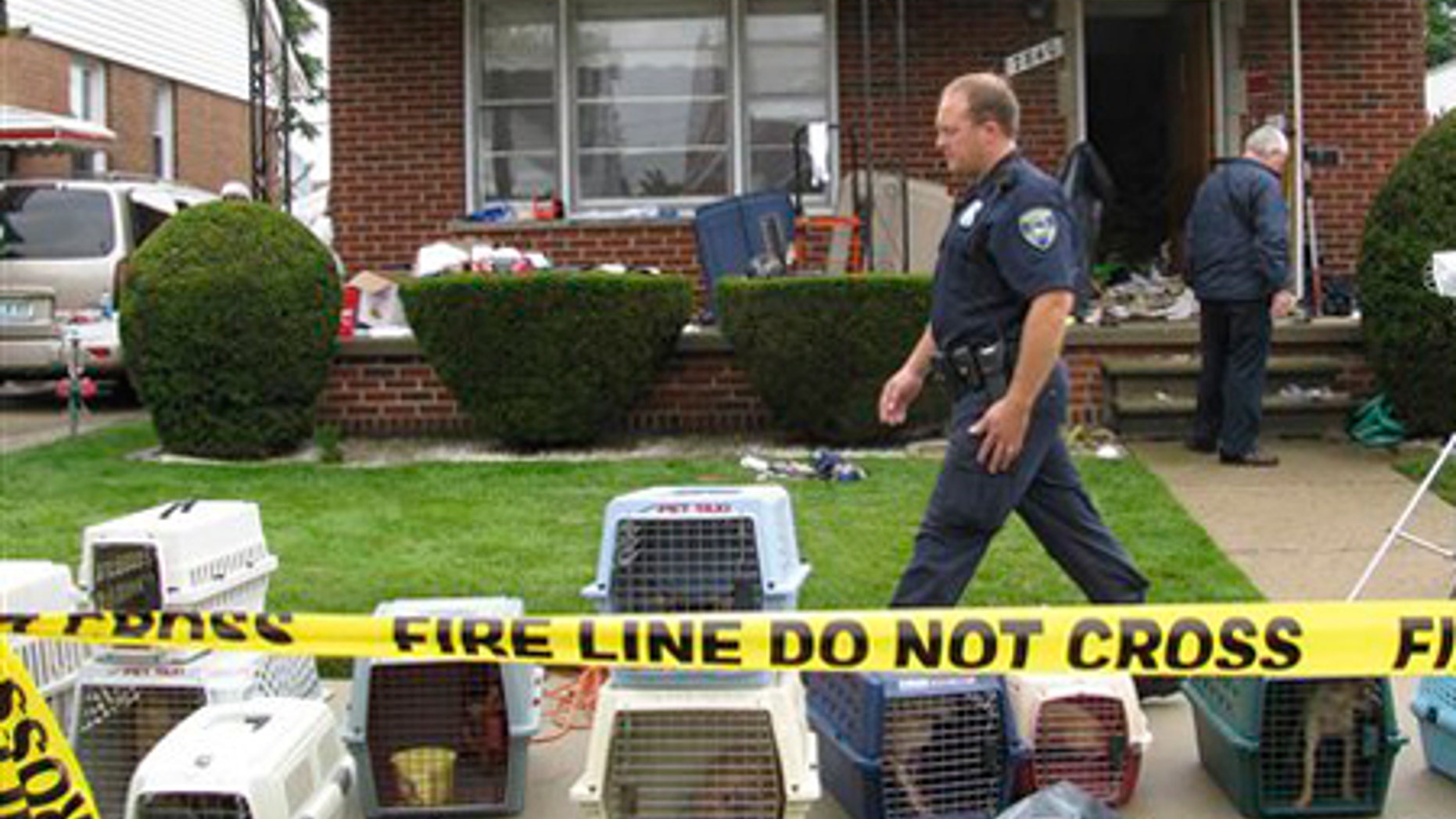 July 22: Law enforcement officials search a home in Dearborn, Mich.