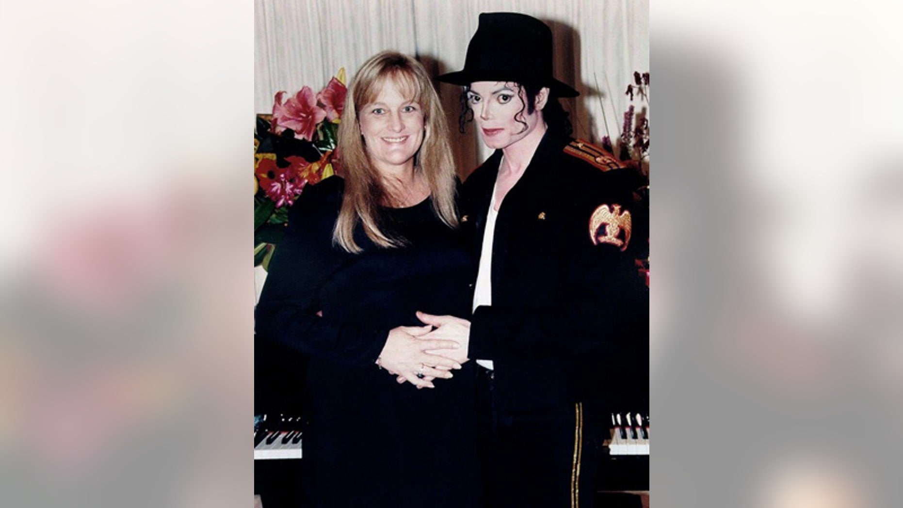 November 14, 1996: Pop star Michael Jackson and his new wife Debbie Rowe pose for a wedding photo minutes after the ceremony in California.