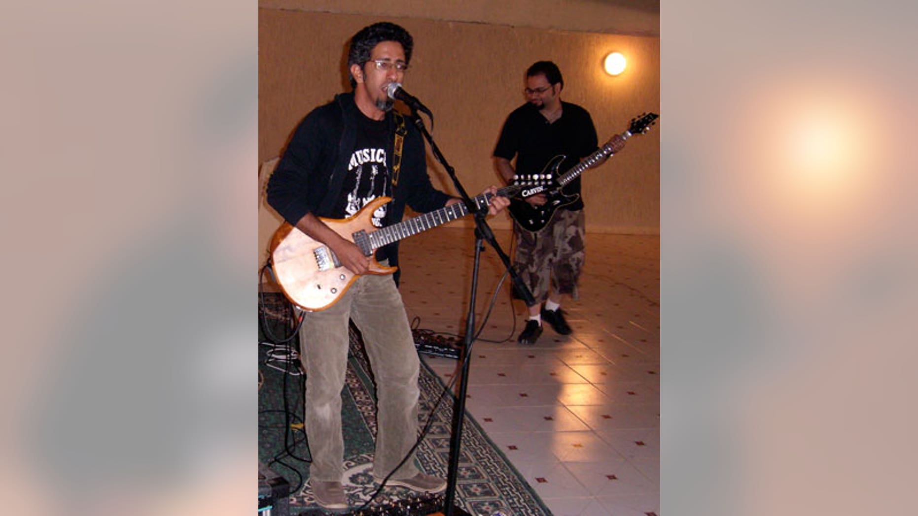 Saudi rock musician and journalist Hasan Hatrash, left, must contend with the unwelcome attention of Saudi Arabia's religious police, which frowns on Western-style music and dress.