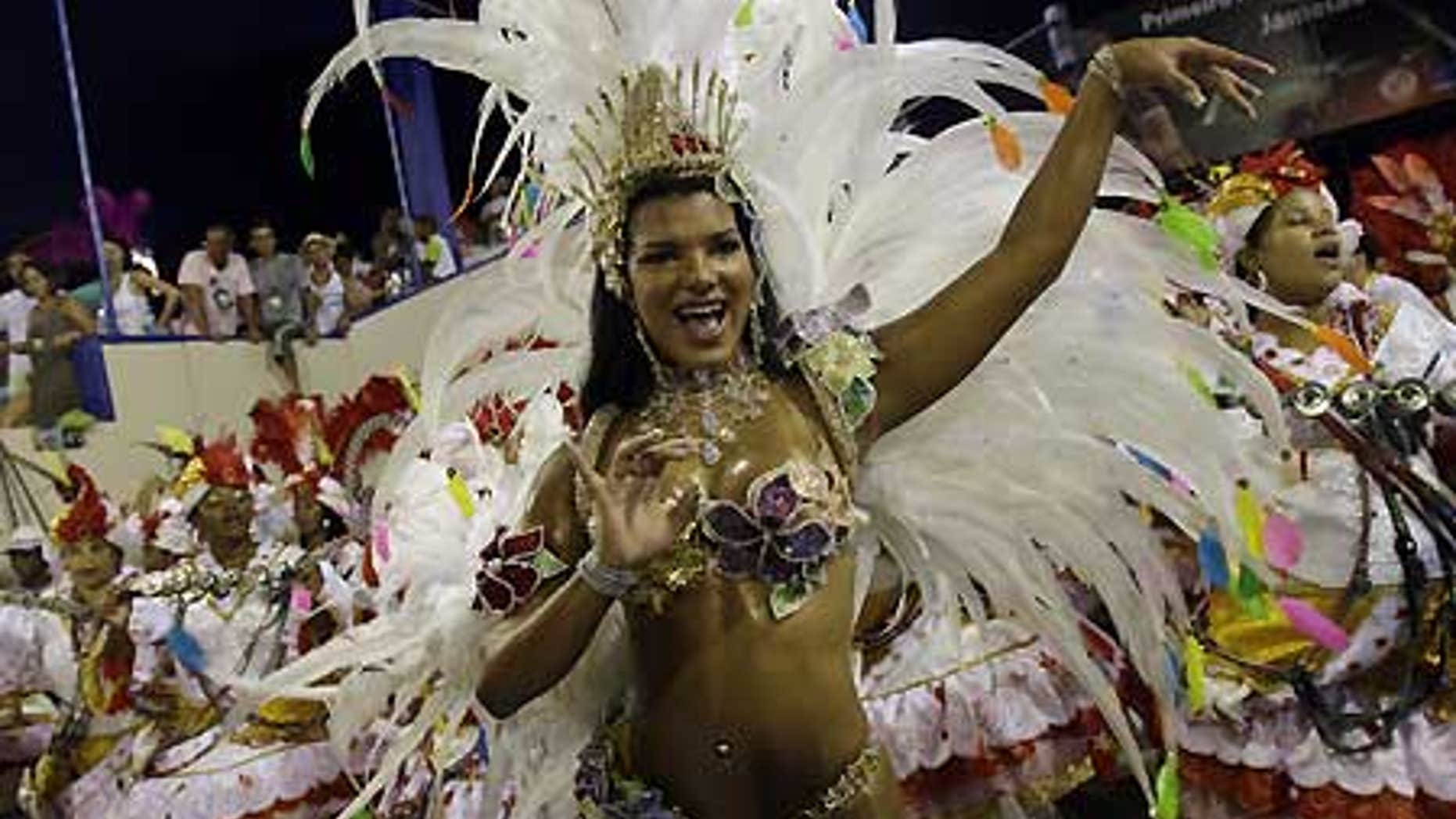 Feb. 24: Juliane Almeida, queen of the drums' section of Viradouro samba school dances during carnival parade at the sambodrome, in Rio de Janeiro.