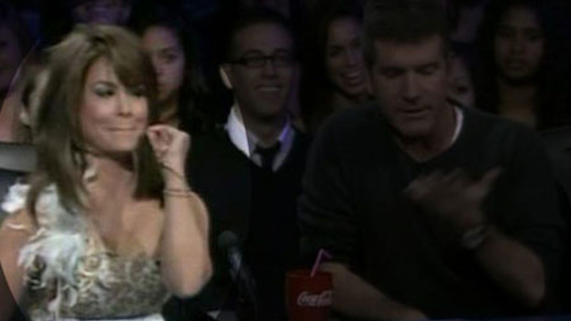 Paula Abdul gives some advice to an overly chatty contestant as the finals get underway.