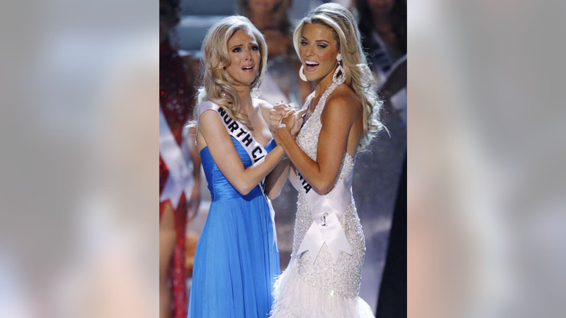 Former Miss California Carrie Prejean, right, congratulates winner, Miss North Carolina Kristen Dalton at the Miss USA pageant.