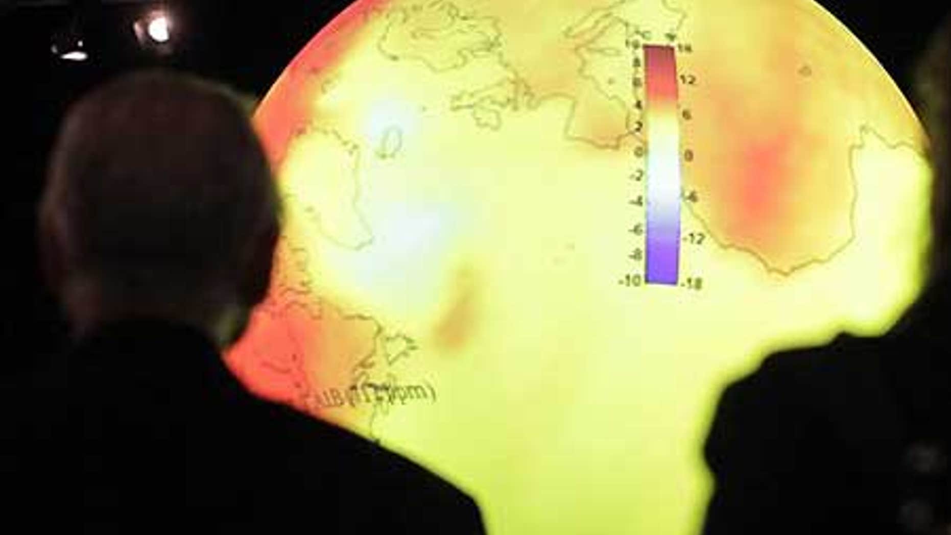 Dec. 8: Delegates look at a giant balloon displaying the warming of the world's oceans at the U.S. center at the U.N. Climate Summit in Copenhagen.