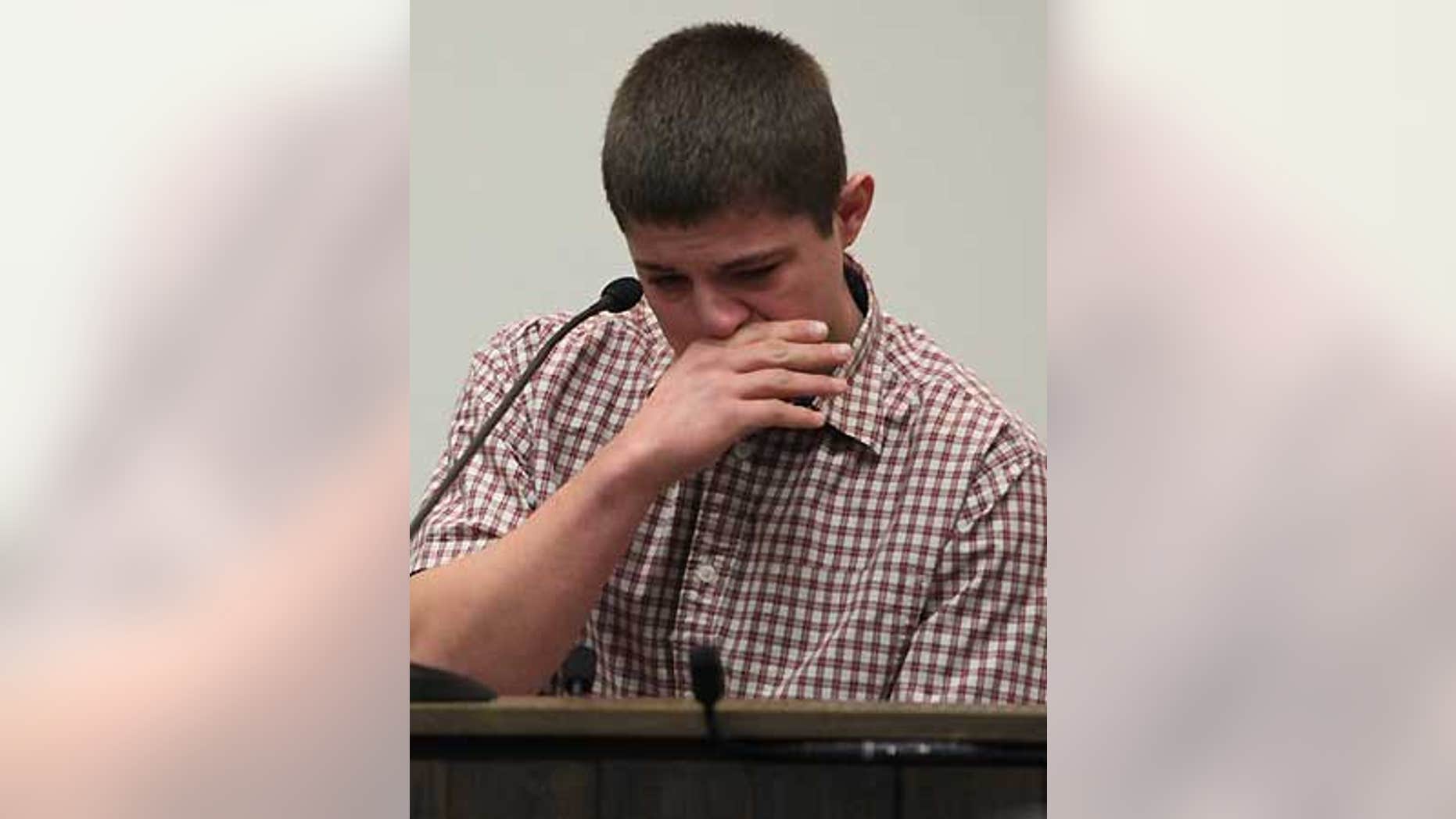 Feb. 12: Brandon Simkins cries at the Butler County Courthouse in Allison, Iowa as he recalls Mark Becker pulling a gun on him.