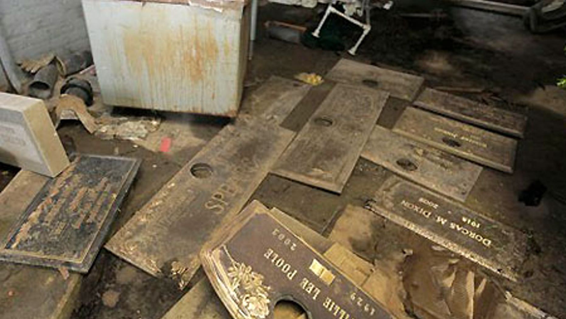 July 10: Grave markers scattered on the floor of a shack at the Burr Oak Cemetery in Alsip, Ill.