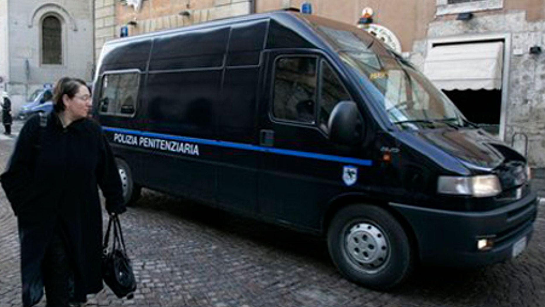 Feb. 6: Two Italian Penitentiary police vans, believed to have on board Amanda Knox and Raffaele Sollecito, arrive at the court building in Perugia.