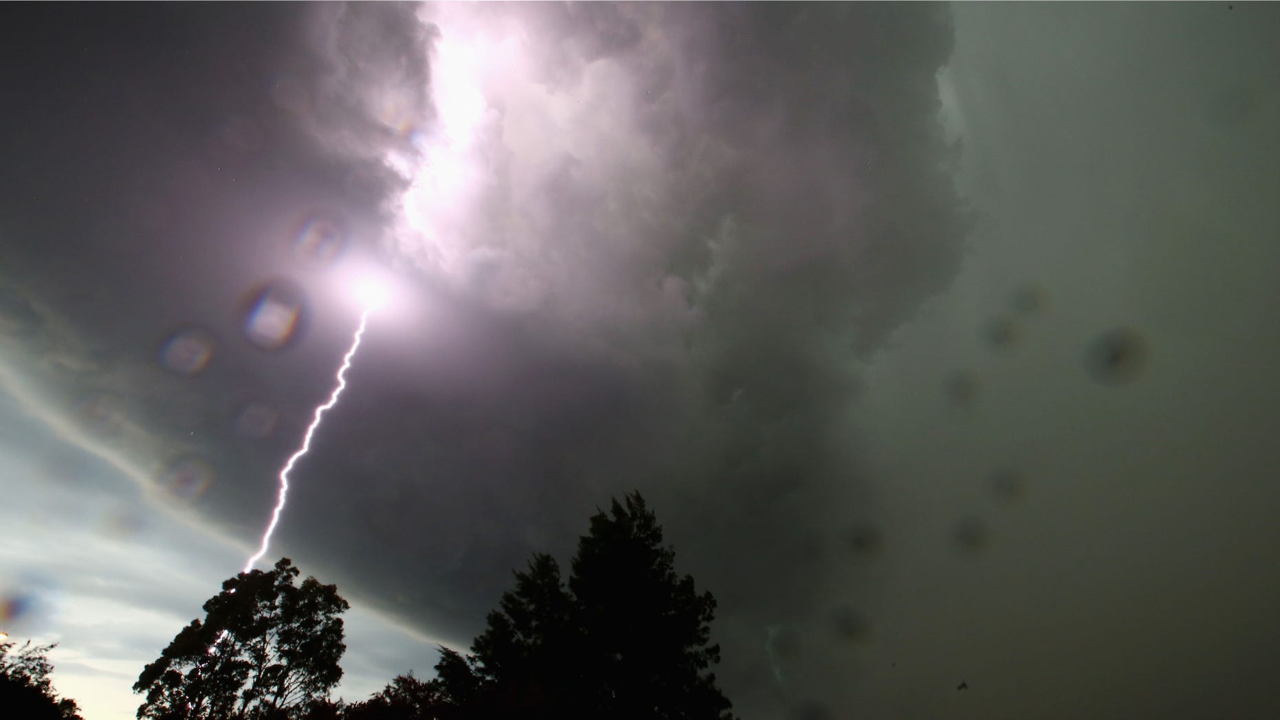 SYDNEY, AUSTRALIA - OCTOBER 13: A general view is seen of a lightning strike as a severe storm hits Sydney on October 13, 2014 in Sydney, Australia. (Photo by Mark Kolbe/Getty Images)