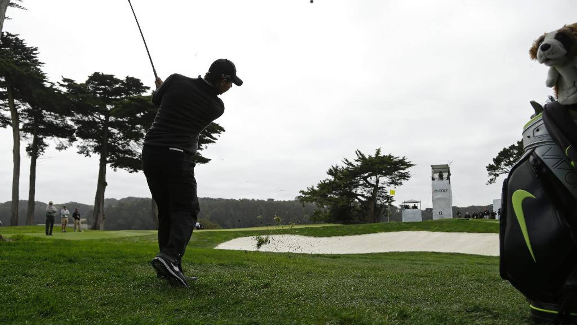 Rory McIlroy, of Northern Ireland, hits out of the rough to the 12th green during the Match Play Championship golf tournament at TCP Harding Park on Sunday, May 3, 2015, in San Francisco. McIlroy won the tournament. (AP Photo/Ben Margot)