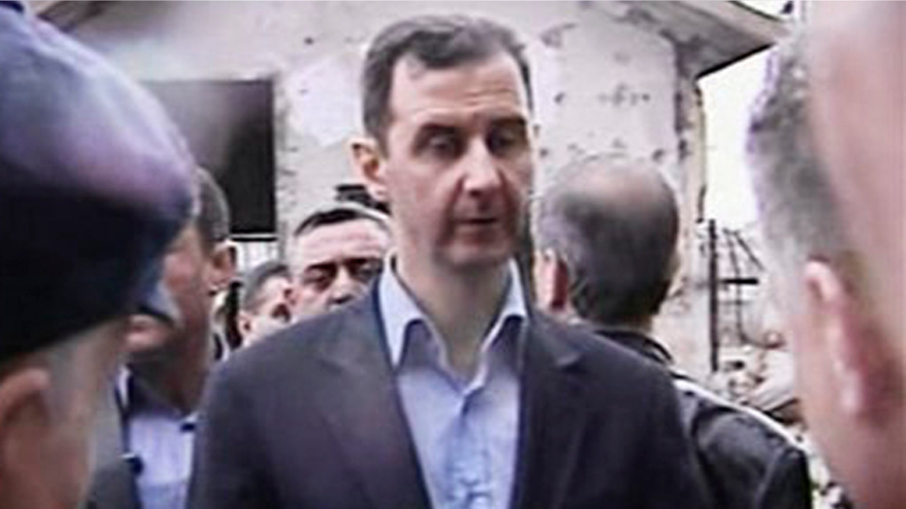 March 27, 2012: In this image made from video, Syrian President Bashar Assad visits Baba Amr neighborhood in Homs, Syria.