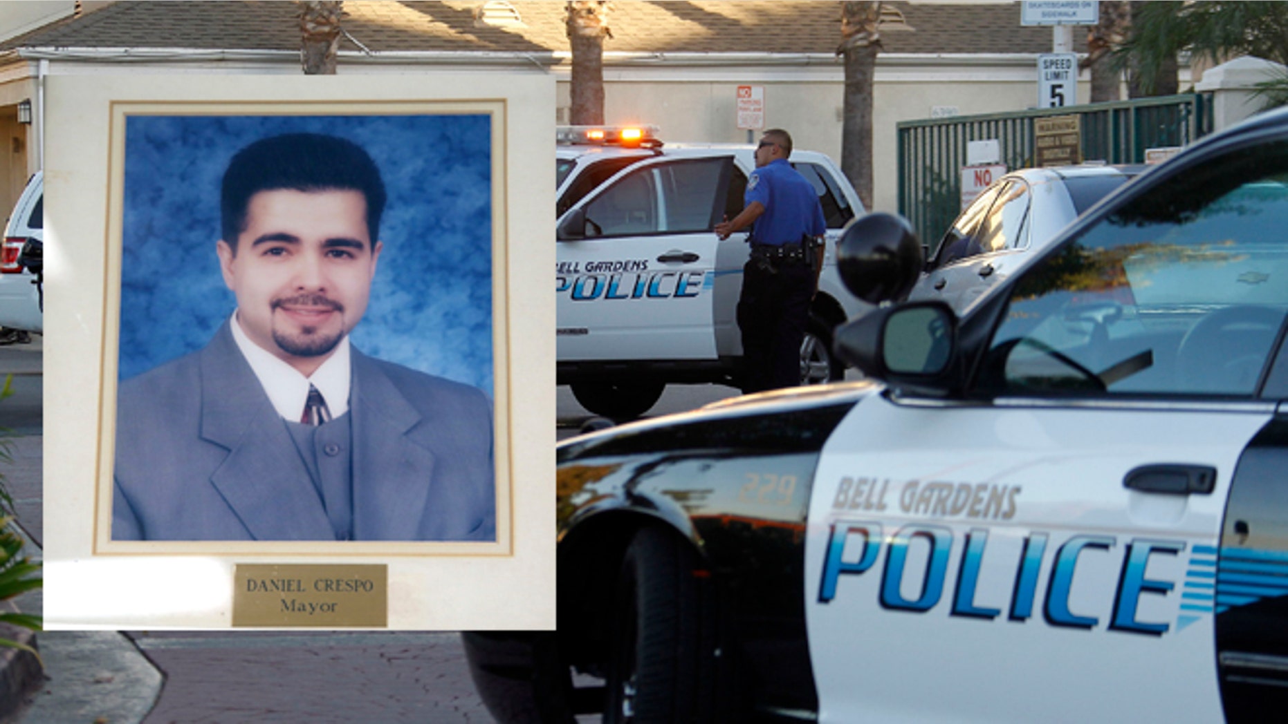 Police officers stand by the scene of a shooting in Bell Gardens, Calif., Tuesday, Sept. 30, 2014. Bell Gardens mayor Daniel Crespo was shot to death Tuesday during an argument with his wife, who was taken into custody, authorities said. (AP Photo/Nick Ut)