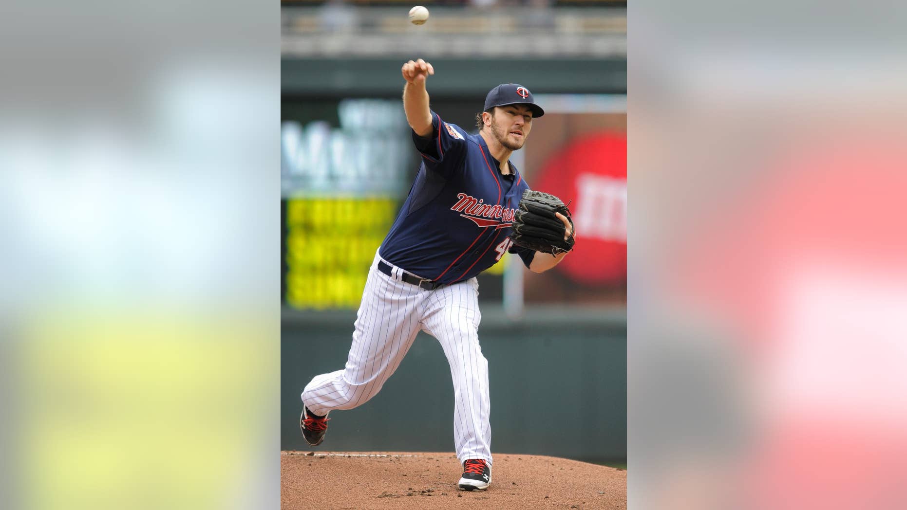 Minnesota Twins’ Phil Hughes throws against the Boston Red Sox during the first inning of a baseball game in Minneapolis, Thursday, May 15, 2014. (AP Photo/Tom Olmscheid)